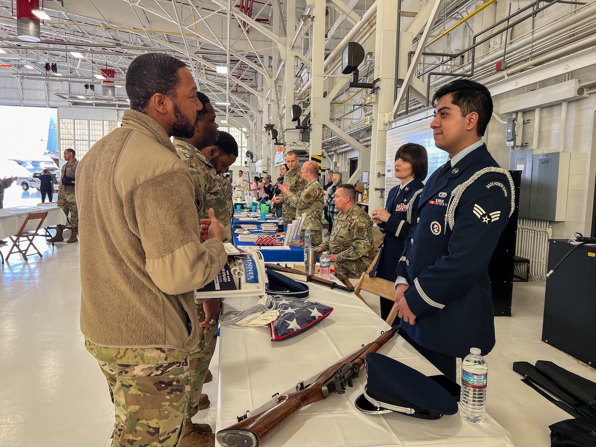 910th Airlift Wing Airmen and 910th Honor Guard members, discuss the duties of being part of the Honor Guard during the 910th AW Career and Diversity Day, April 6, 2024, at Youngstown Air Reserve Station, Ohio.