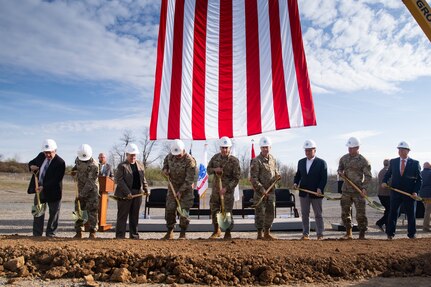 people with shovels at ceremony