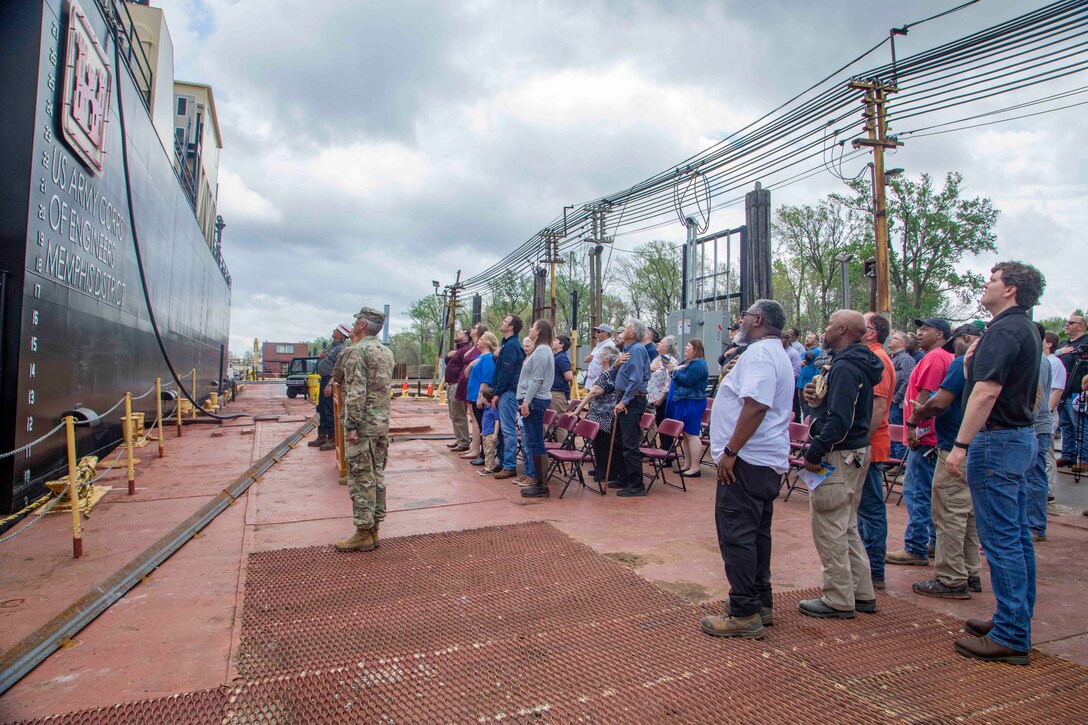 The  U.S. Army Corps of Engineers, Memphis District, christened its new dry dock during a ceremony held at Ensley Engineer Yard, April 2, 2024.

The dry dock was named after Billy Manley, who worked as the yards and docks chief for the district until his passing in 2020. 

More than 80 people attended the christening, including several members of Manley's family, his friends, and district employees. In keeping with USACE tradition, Manley's wife, Teresa Manley, conducted the act of christening and District Commander Col. Brian Sawser directed it to service to the current chief of yards and docks, Dennis Lewis.

The Dry Dock Manley was constructed at Conrad Shipyard in Morgan City, Louisiana, before arriving at Ensley Engineer Yard on December 15, 2023. It is 168 feet long, has a 77-foot beam, a draft of 4.5 feet, and a lifting capacity of 1000 tons.