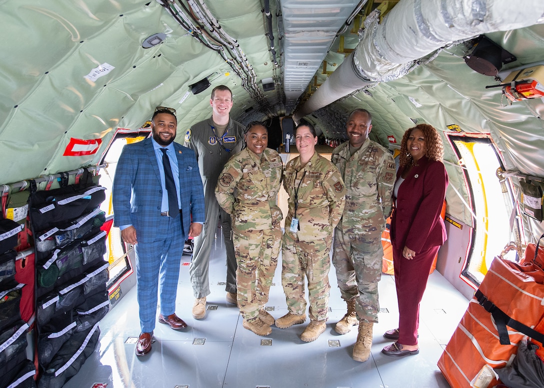 State delegates pose for a photo with military members on a KC-135 Stratotanker at the third annual Joint Base Andrews State of the Base Address, April 10, 2024.