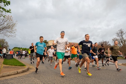 runners race along road at military base