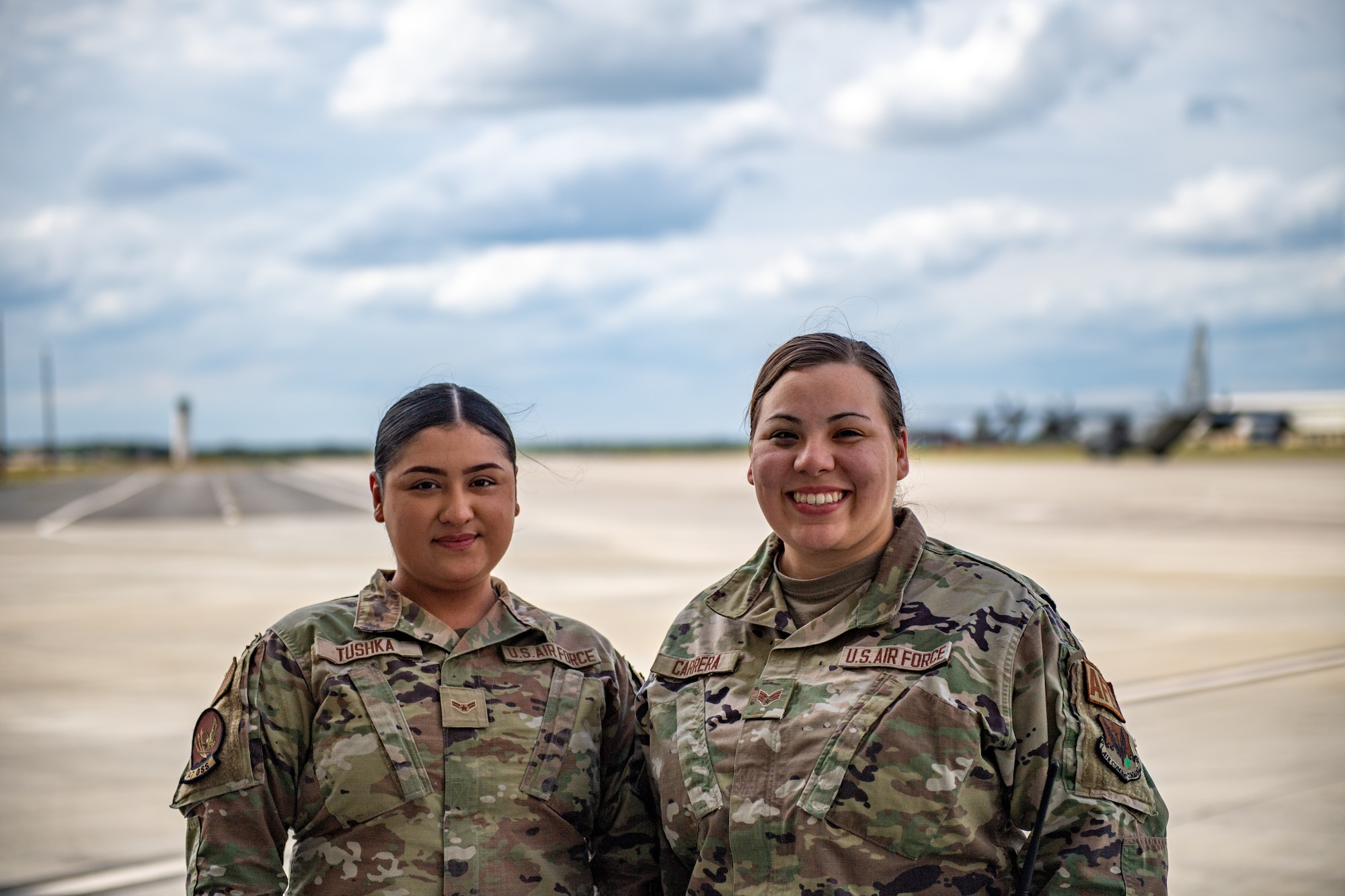 U.S. Air Force Airman 1st Class Hailey Tushka, 347th Operations Support Squadron aircrew flight equipment technician (left), and Senior Airman Alayna Carrera, 347th OSS aircrew flight technician, pose for a photo during Exercise Ready Tiger 24-1 at Savannah Air National Guard Base, Georgia, April 9, 2024. Ready Tiger 24-1 is a readiness exercise demonstrating the 23rd Wing’s ability to plan, prepare and execute operations and maintenance to project air power in contested and dispersed locations, defending the United States’ interests and allies. (U.S. Air Force photo by Senior Airman Courtney Sebastianelli)