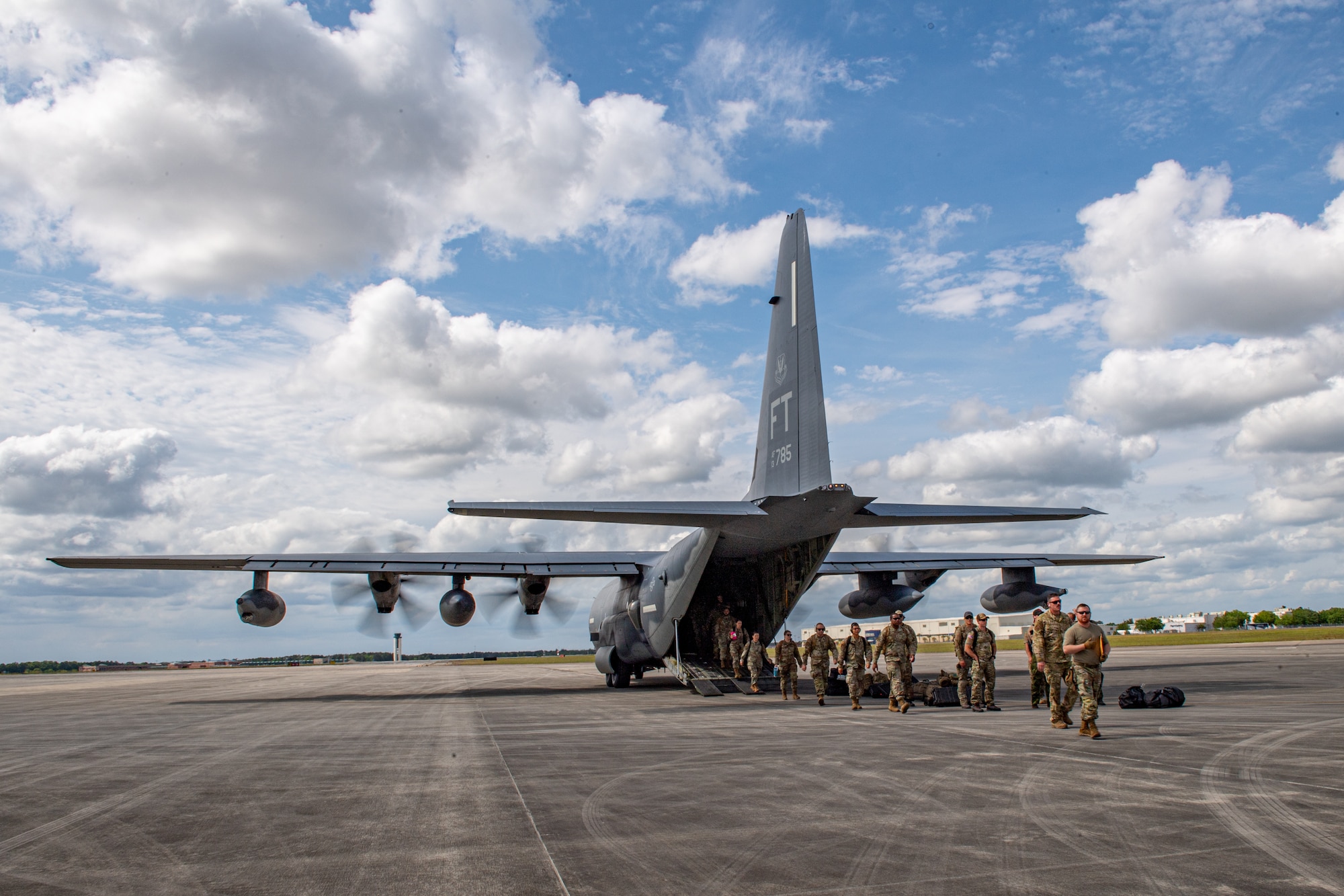 U.S. Air Force Tech. Sgt. Benjamin Griggs, 347th Operations Support Squadron air transportation supervisor, leads Airmen off an HC-130J Combat King II during Exercise Ready Tiger 24-1 at Savannah Air National Guard Base, Georgia, April 9, 2024. Ready Tiger 24-1 is a readiness exercise demonstrating the 23rd Wing’s ability to plan, prepare and execute operations and maintenance to project air power in contested and dispersed locations, defending the United States’ interests and allies. (U.S. Air Force photo by Senior Airman Courtney Sebastianelli)