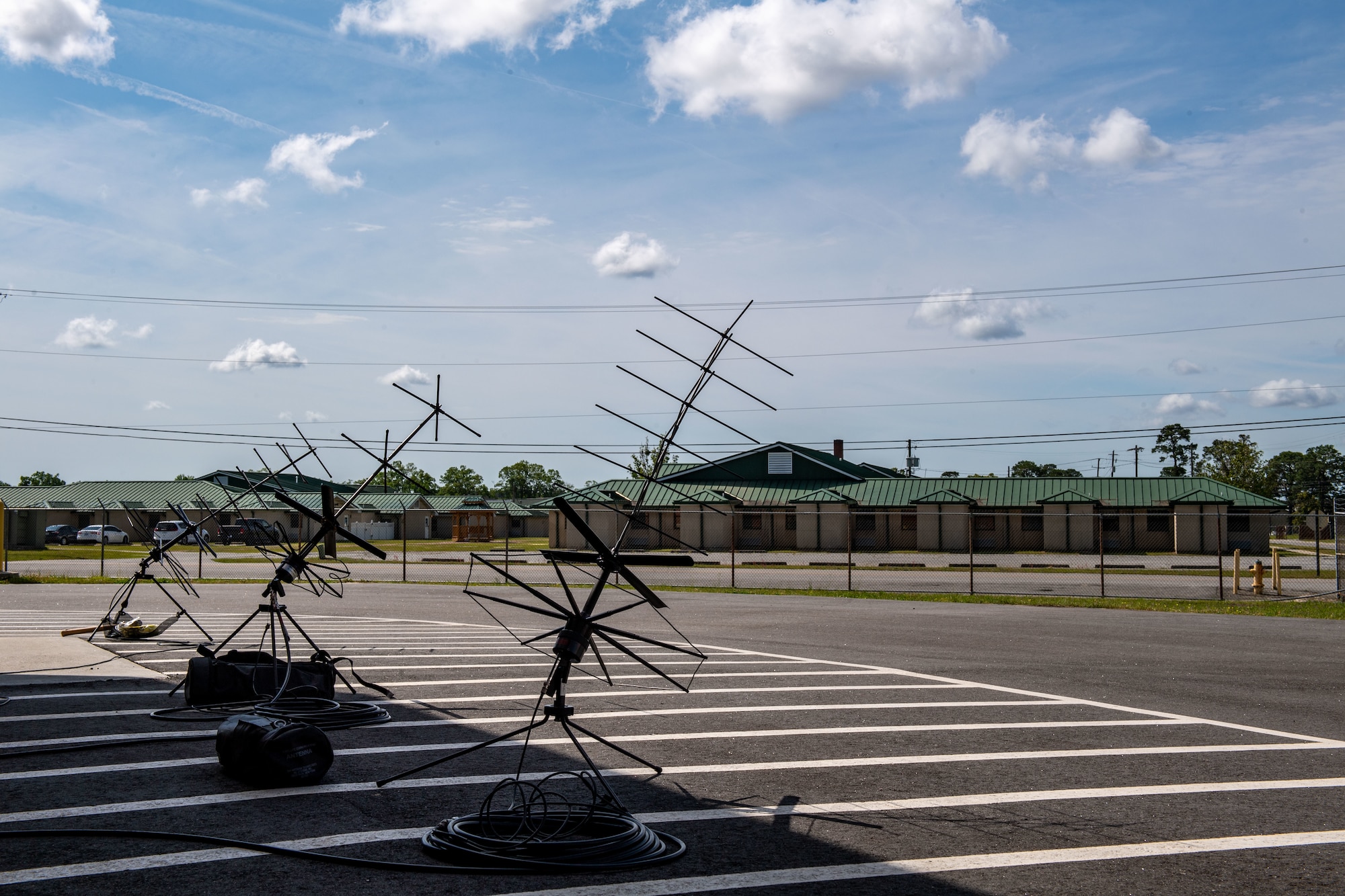 Three tactical satellite antennas sit at Savannah Air National Guard Base, Georgia, April 9, 2024.  The antennas were used during Exercise Ready Tiger 24-1 to transfer signals to radios for communication at a forward operating site. Ready Tiger 24-1 is a readiness exercise demonstrating the 23rd Wing’s ability to plan, prepare and execute operations and maintenance to project air power in contested and dispersed locations, defending the United States’ interests and allies. (U.S. Air Force photo by Senior Airman Courtney Sebastianelli)