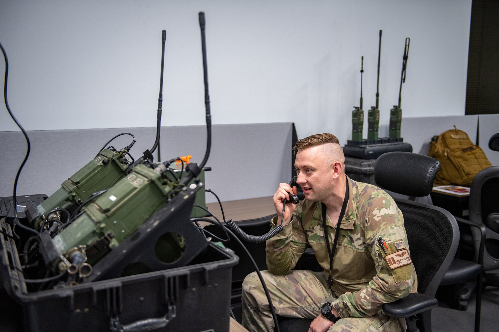 U.S. Air Force Capt. Drew Houghton, 71st Rescue Squadron combat systems officer, relays information from the forward operating site during Exercise Ready Tiger 24-1 at Savannah Air National Guard Base, Georgia, April 9, 2024. Built upon Air Combat Command's directive to assert air power in contested environments, Exercise Ready Tiger 24-1 aims to test and enhance the 23rd Wing’s proficiency in executing Lead Wing and Expeditionary Air Base concepts through Agile Combat Employment and command and control operations. (U.S. Air Force photo by Senior Airman Courtney Sebastianelli)