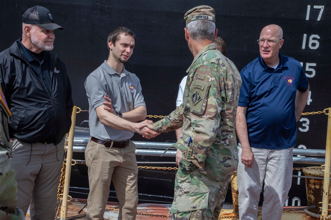 The  U.S. Army Corps of Engineers, Memphis District, christened its new dry dock during a ceremony held at Ensley Engineer Yard, April 2, 2024.

The dry dock was named after Billy Manley, who worked as the yards and docks chief for the district until his passing in 2020. 

More than 80 people attended the christening, including several members of Manley's family, his friends, and district employees. In keeping with USACE tradition, Manley's wife, Teresa Manley, conducted the act of christening and District Commander Col. Brian Sawser directed it to service to the current chief of yards and docks, Dennis Lewis.

The Dry Dock Manley was constructed at Conrad Shipyard in Morgan City, Louisiana, before arriving at Ensley Engineer Yard on December 15, 2023. It is 168 feet long, has a 77-foot beam, a draft of 4.5 feet, and a lifting capacity of 1000 tons.