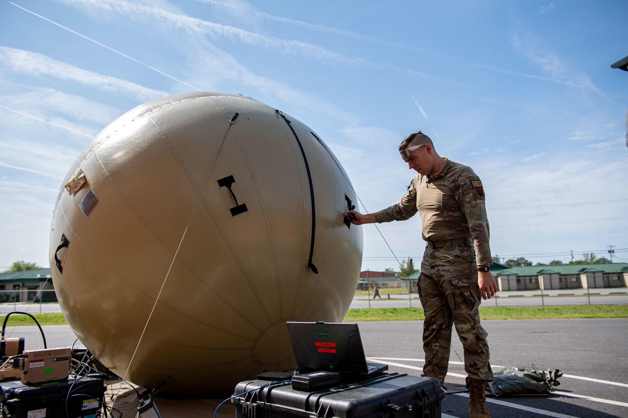 U.S. Air Force Tech. Sgt. Leif Anderson, 52nd Combat Communications Squadron tactical communications supervisor, manually maneuvers a Global Air Terminal Radio during Exercise Ready Tiger 24-1 at Savannah Air National Guard Base, Georgia, April 9, 2024. Equipment such as the GATR establishes secure communication for command and control in distributed operations. The Ready Tiger 24-1 exercise evaluators will assess the 23rd Wing's proficiency in employing decentralized command and control to fulfill air tasking orders across geographically dispersed areas amid communication challenges. (U.S. Air Force photo by Senior Airman Courtney Sebastianelli)