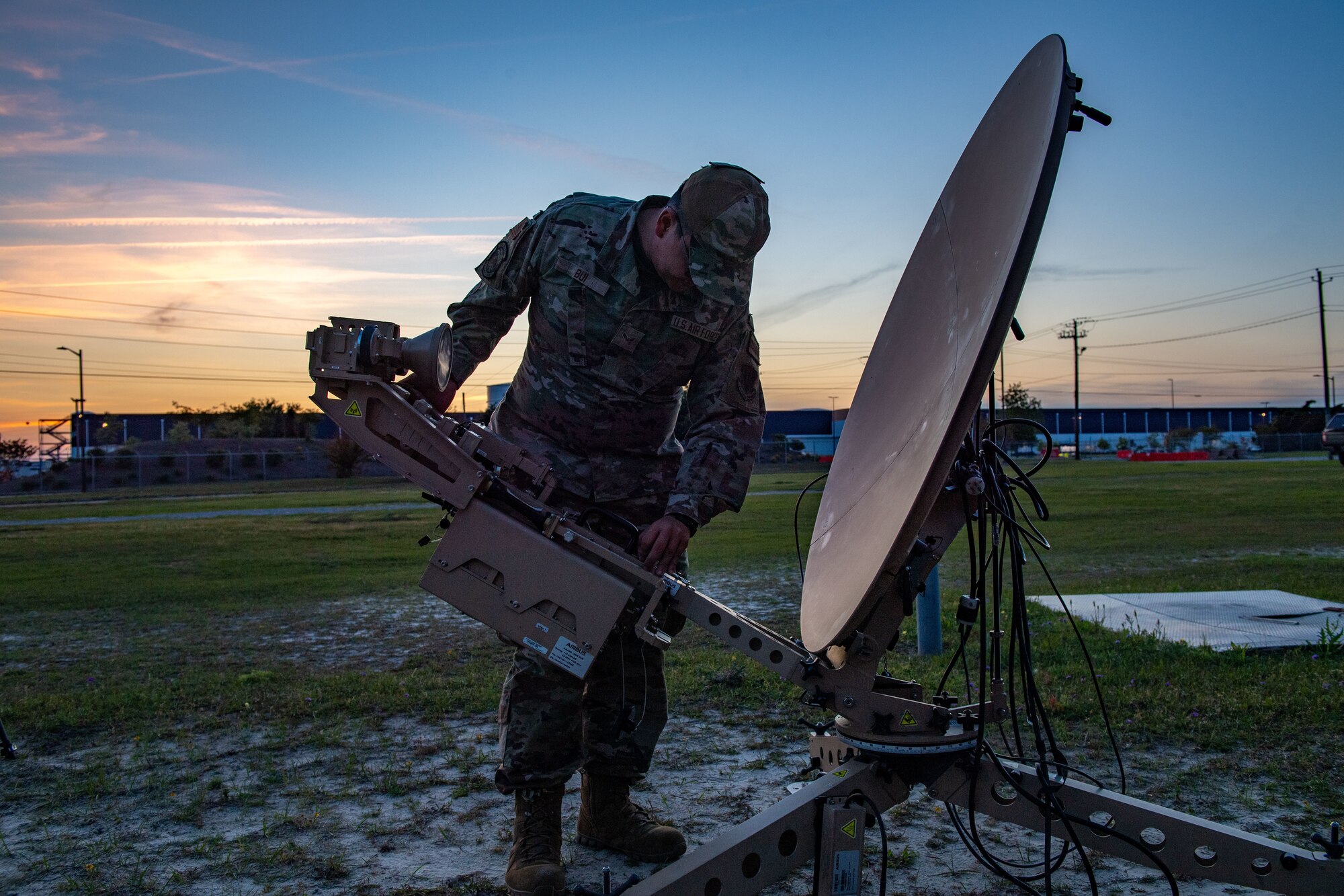 U.S. Air Force Airman 1st Class Bui Bryant, 52nd Combat Communication Squadron radio frequency operator, sets up an airbus 1.2 antenna during Exercise Ready Tiger 24-1 at Savannah Air National Guard Base Georgia, April 8, 2024. Built upon Air Combat Command's directive to assert air power in contested environments, Exercise Ready Tiger 24-1 aims to test and enhance the 23rd Wing’s proficiency in executing Lead Wing and Expeditionary Air Base concepts through Agile Combat Employment and command and control operations. (U.S. Air Force photo by Senior Airman Courtney Sebastianelli)