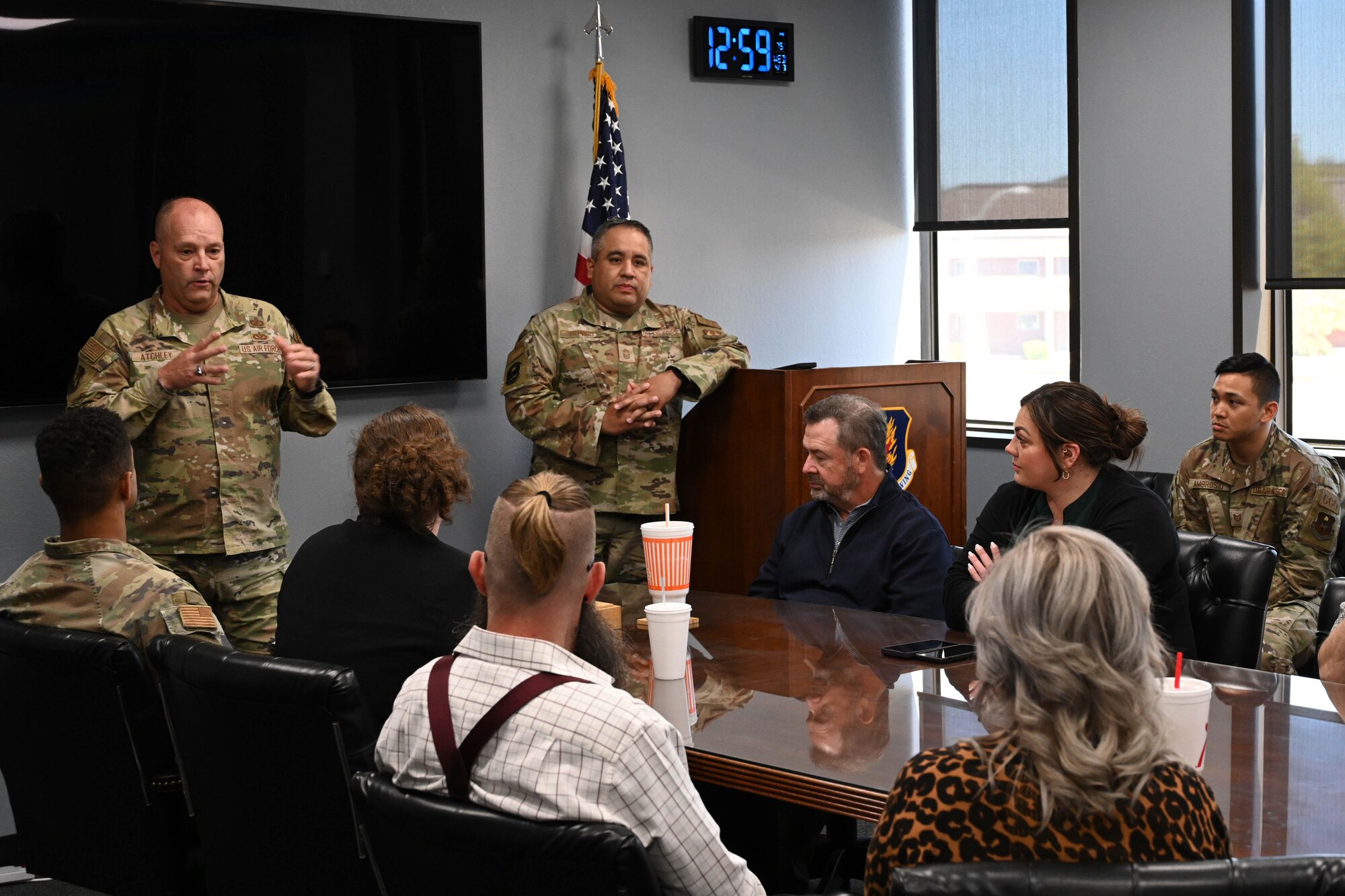 U.S. Air Force Col. James Atchley (left), Air Force installation Contracting Center on location director of contracting for Air Education and Training Command, and Chief Master Sgt. Christopher Trevino (center), Air Force Installation Contracting Agency chief enlisted manager, speak to Airmen from the 97th Contracting Flight (CONF) during a visit at Altus Air Force Base, Oklahoma, April 3, 2024. Throughout the day, Atchley and Trevino held multiple group and one-on-one sessions with Airmen and leadership from the 97th CONF. (U.S. Air Force photo by Senior Airman Miyah Gray)