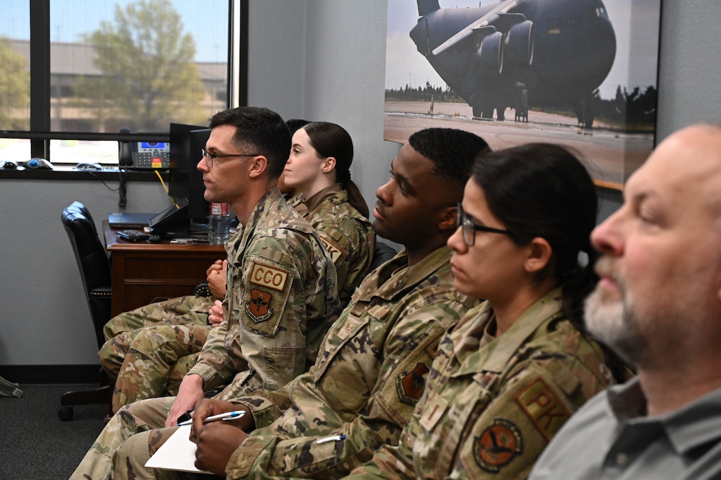 Airmen from the 97th Contracting Flight attend a briefing with Air Education and Training Command (AETC) Contracting leadership at Altus Air Force Base, Oklahoma, April 3, 2024. During the brief, AETC leadership discussed mission priorities, goals, and contingency training plans. (U.S. Air Force photo by Senior Airman Miyah Gray)