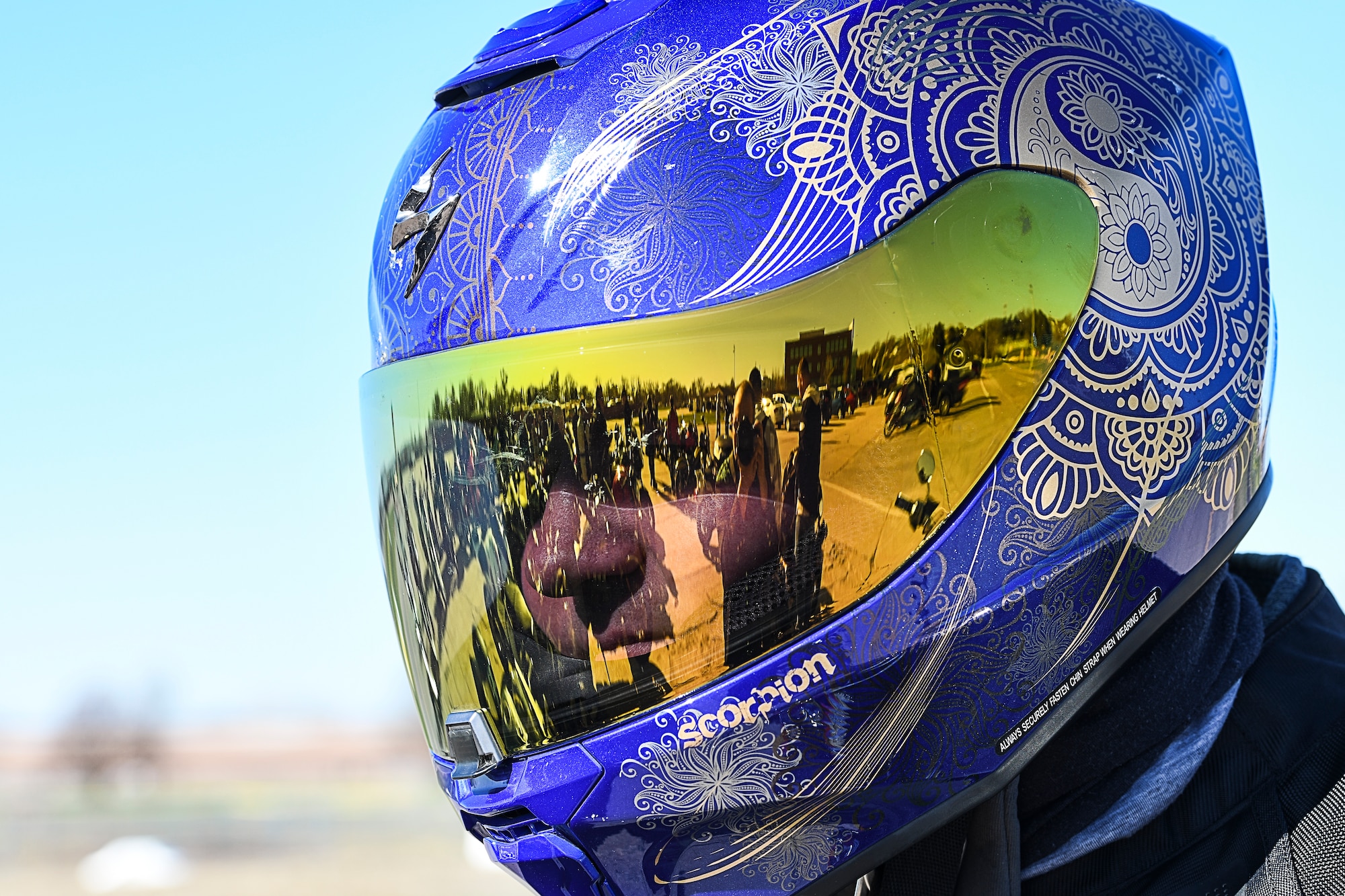 motorcycles reflected in a motorcycle helmet
