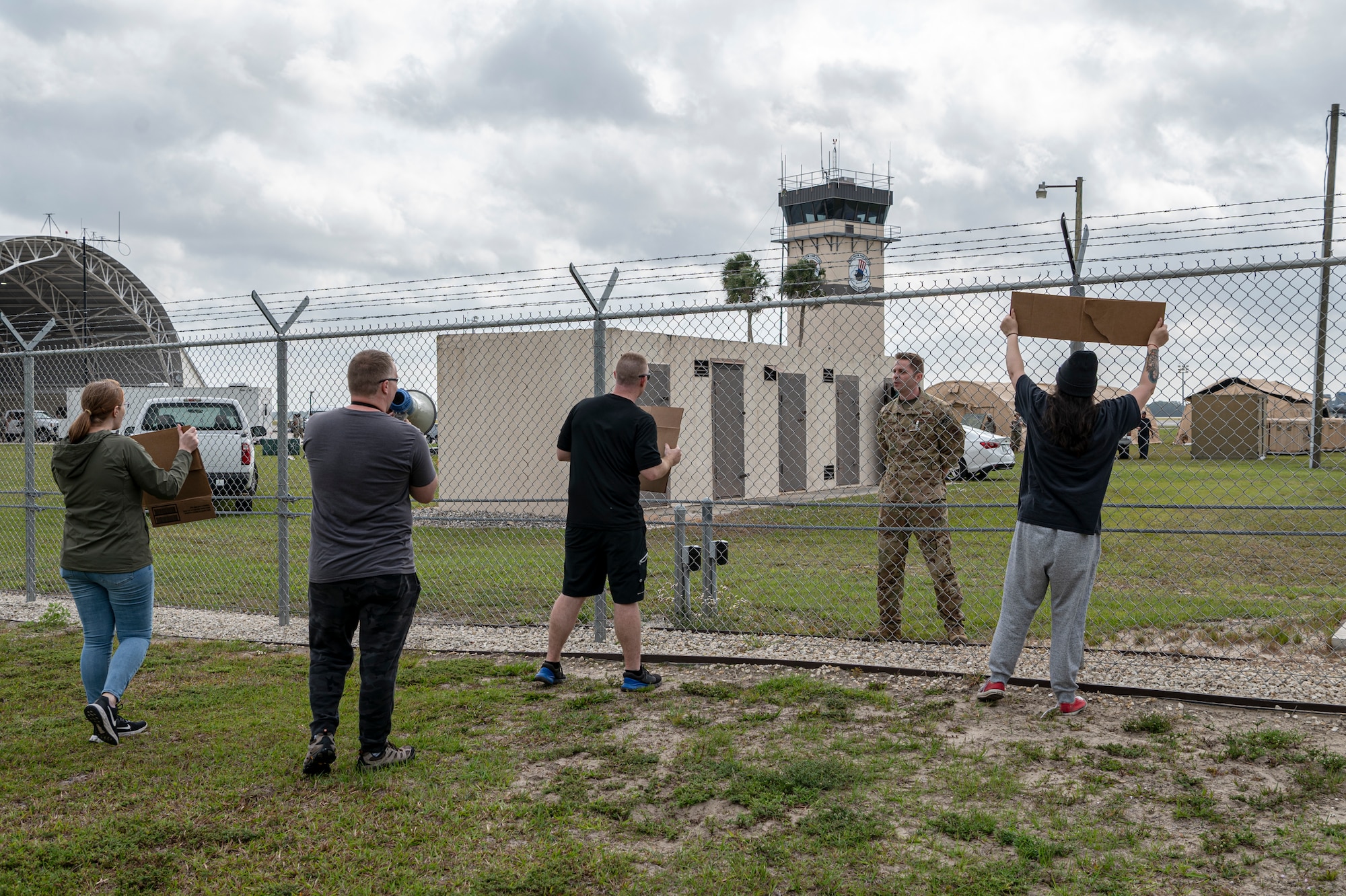 U.S. Air Force Maj. Michael Rehme, 23rd Wing chief of plans and integration, watches Airmen assigned to the 23rd Wing inspection team simulate a peaceful protest during Exercise Ready Tiger 24-1 at Avon Park Air Force Range, Florida, April 11, 2024. Inspectors observed the exercise participant’s response to the non-violent protest. Ready Tiger 24-1 is a readiness exercise demonstrating the 23rd Wing’s ability to plan, prepare and execute operations and maintenance to project air power in contested and dispersed locations, defending the United States’ interests and allies. (U.S. Air Force photo by Airman 1st Class Leonid Soubbotine)