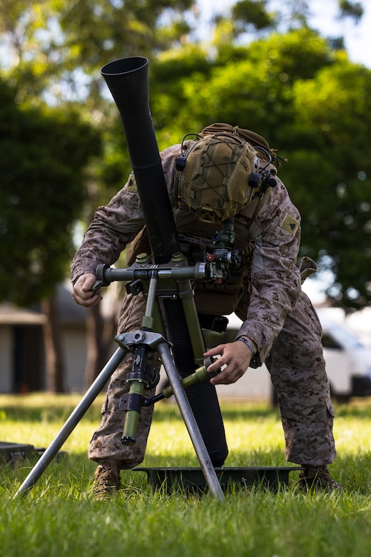 U.S. Marine Corps Cpl. Kaleb Waggoner, a squad leader with Weapons Company, 2nd Battalion, 5th Marine Regiment (Reinforced), Marine Rotational Force – Darwin 24.3, rehearses M252 81 mm mortar system gun drills at Robertson Barracks, Darwin, NT, Australia, April 11, 2024. MRF-D 24.3 is part of an annual six-month rotational deployment to enhance interoperability with the Australian Defense Force and Allies and partners and provide a forward-postured crisis response force in the Indo-Pacific. Waggoner is a native of Ohio. (U.S. Marine Corps photo by Cpl. Earik Barton)