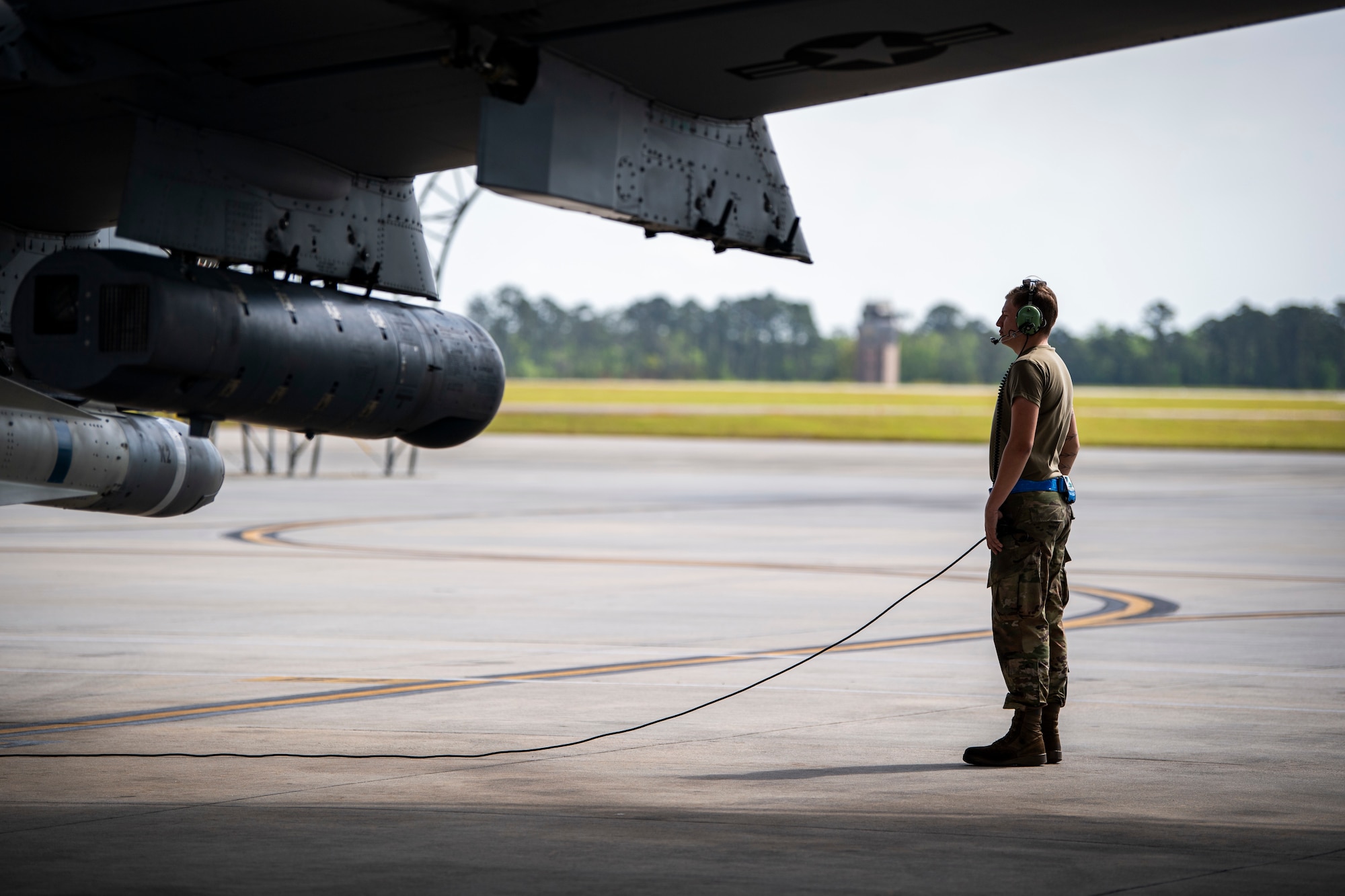 A U.S. Air Force crew chief assigned to the 23rd Maintenance Group performs final preflight checks on an A-10C Thunderbolt II in preparation for take-off during Exercise Ready Tiger 24-1 at Moody Air Force Base, Georgia, April 9, 2024. Crew chiefs collaborate closely with pilots and other maintenance personnel to ensure the safety and readiness of the aircraft.  The Ready Tiger 24-1 exercise evaluators will assess the 23rd Wing's proficiency in employing decentralized command and control to fulfil air tasking orders across geographically dispersed areas amid communication challenges. (U.S. Air Force photo by 2nd Lt. Benjamin Williams)