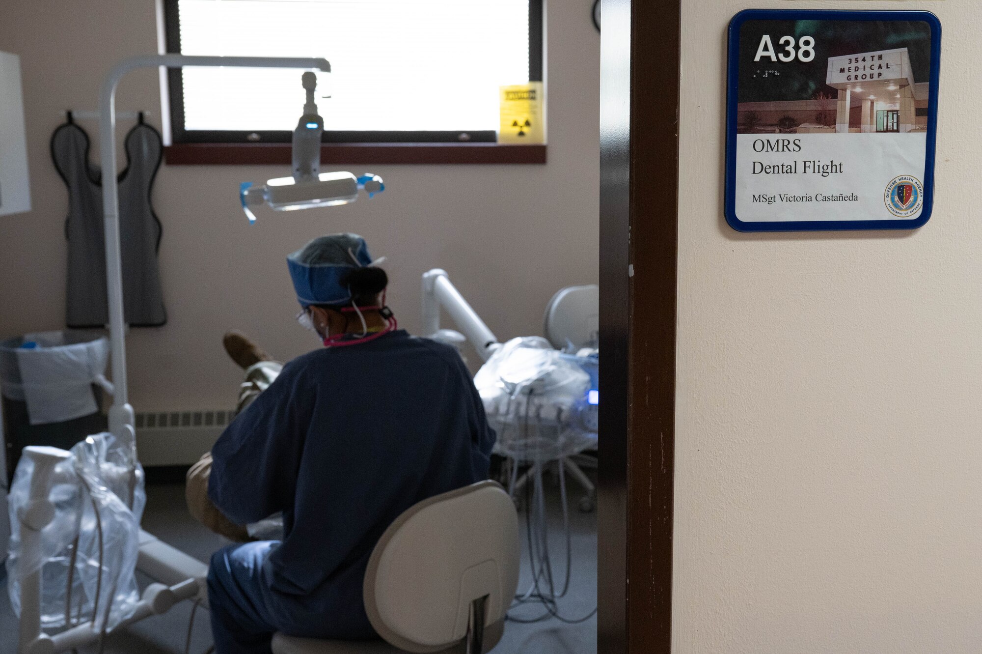 U.S. Air Force Master Sgt. Victoria Castaneda, 354th Operational Medical Readiness Squadron chief of preventive dentistry, conducts a teeth cleaning on a patient at Eielson Air Force Base, Alaska, April 3, 2024.