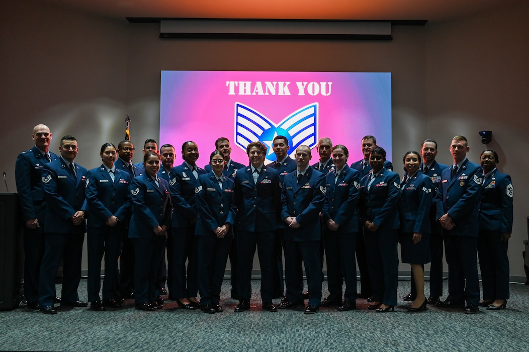 A group of new 433rd Airlift Wing and 960th Cyberspace Wing Non-Commissioned Officers and both wing's senior leaders pose for a photo after an NCO Induction Ceremony on Joint Base San Antonio-Lackland, Texas on April 6, 2024.