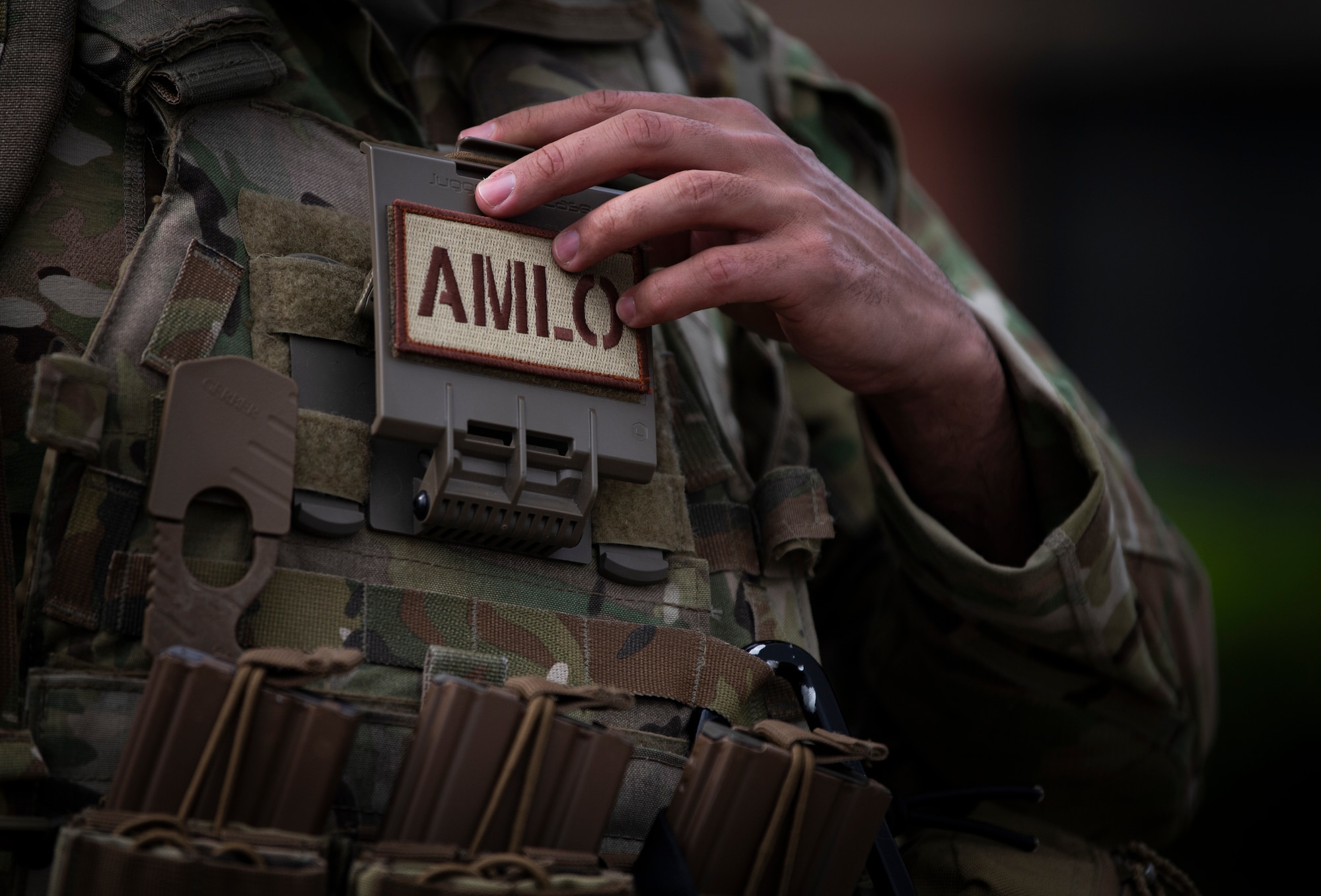 U.S. Air Force Lt. Col. Vincent Levraea, a 621st Mobility Support Operations Squadron air mobility liason officer, adjusts his interceptor body armor during Exercise SWAMP AVENGER 24-2 at North Auxillary Field, South Carolina, April 2, 2024.