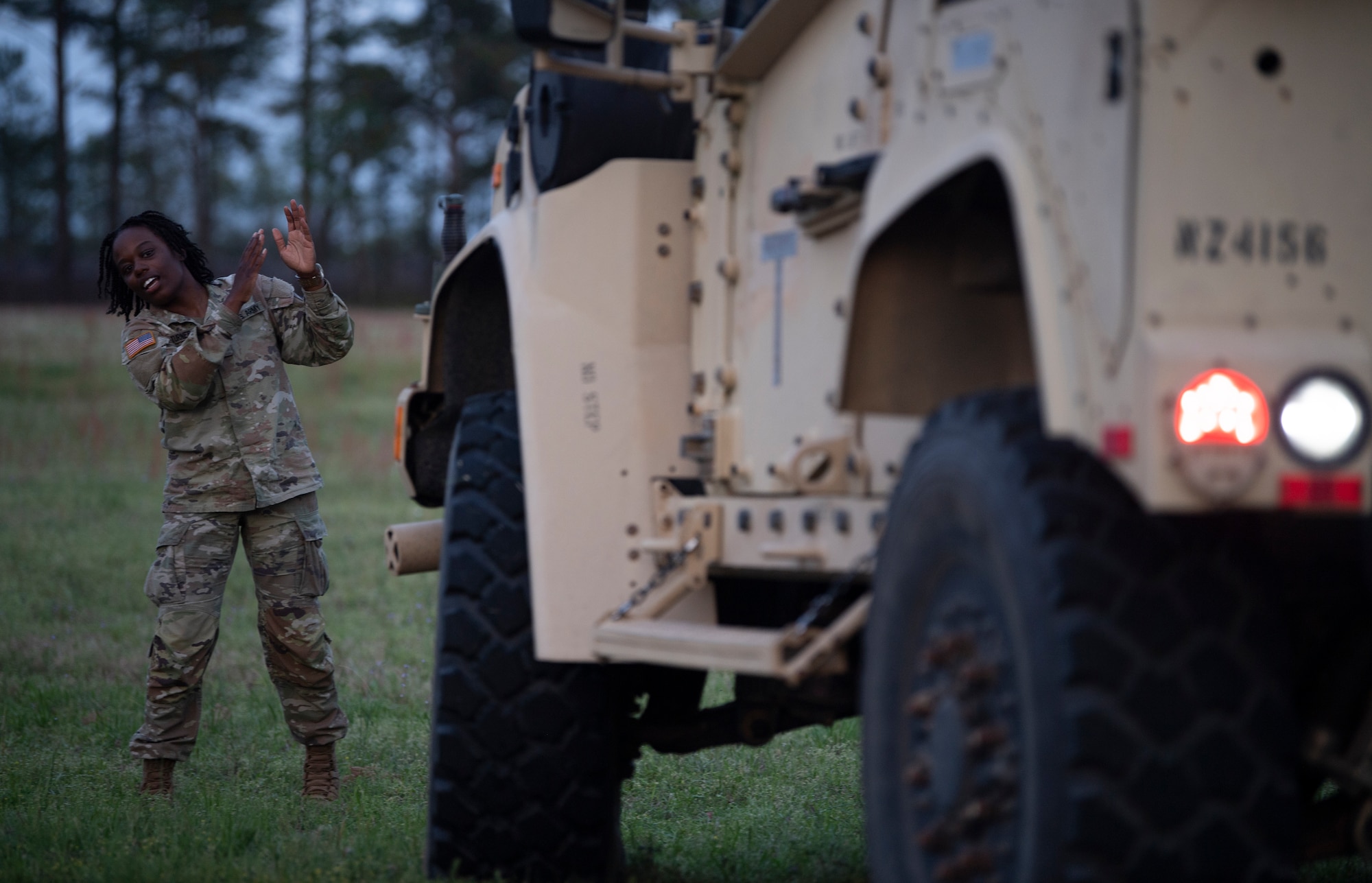 U.S. Army Corp. Shakayla Turner, 5th Squadron, 7th Cavalry Regiment solider assigned to Fort Stewart, Georgia, marshals a joint light tactical vehicle during Exercise SWAMP AVENGER 24-2 at North Auxillary Field, South Carolina, April 2, 2024.