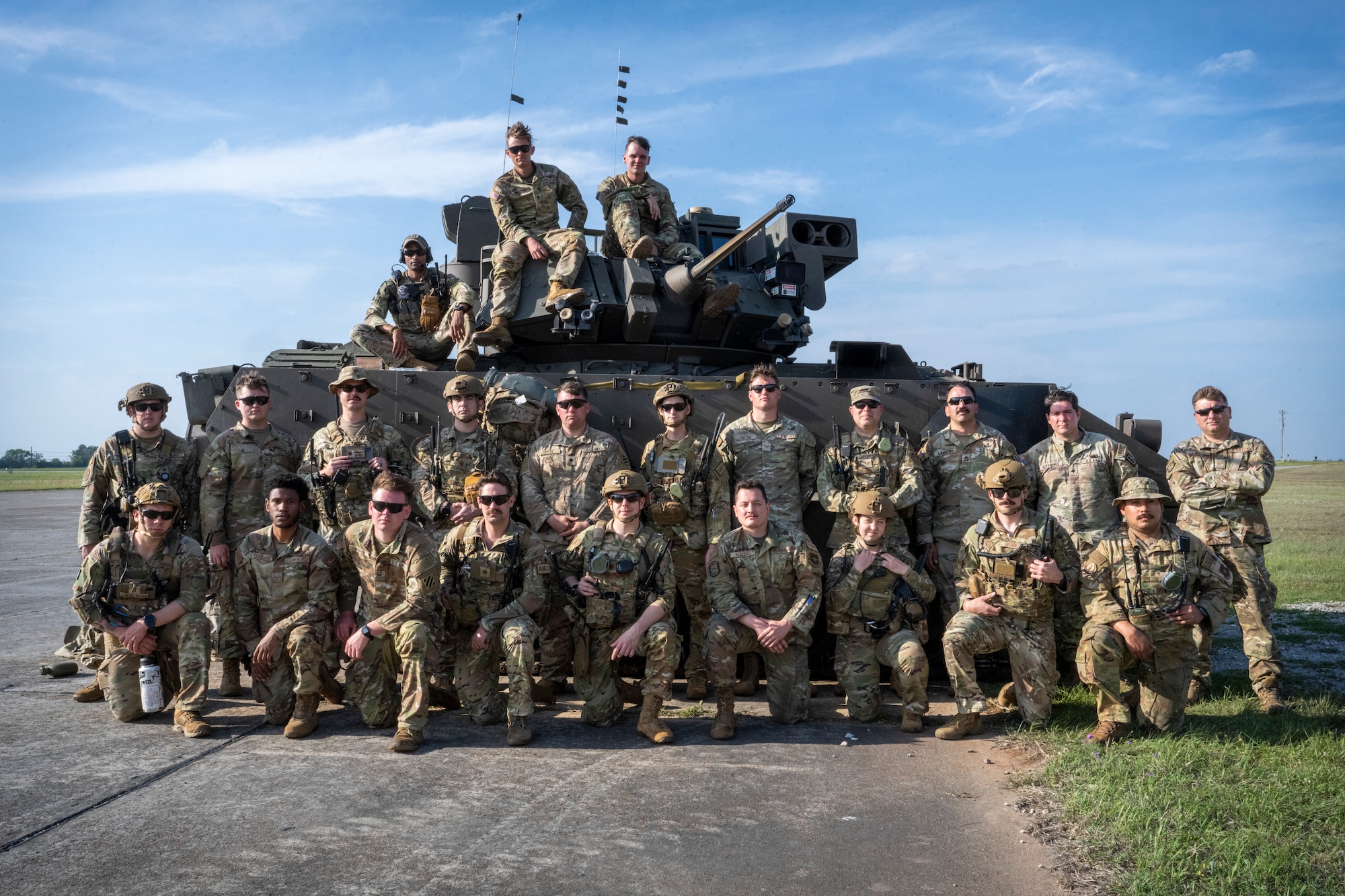 Airmen with the 621st Air Mobility Advisory Group assigned to and soliders with the 5th Squadron, 7th Cavalry Regiment, pose for group photo during Exercise SWAMP AVENGER 24-2 at North Auxillary Field, South Carolina, April 2, 2024