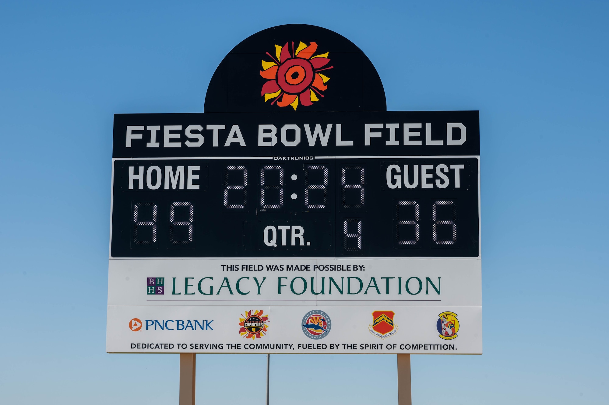 The Fiesta Bowl Field scoreboard stands over the new track and field during a ribbon cutting ceremony, April 11, 2024, at Luke Air Force Base, Arizona.