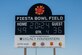 The Fiesta Bowl Field scoreboard stands over the new track and field during a ribbon cutting ceremony, April 11, 2024, at Luke Air Force Base, Arizona. The ceremony capped off an eight month renovation project of Luke’s outdoor track and football field, with the new turf having been used during the 2023 Fiesta Bowl football game. (U.S. Air Force photo by Senior Airman Jakob Hambright)