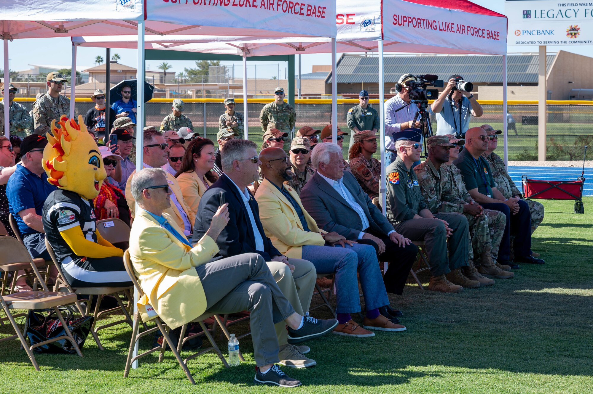 Leadership and other community members of the 56th Fighter Wing attend a ribbon cutting ceremony of the Fiesta Bowl field, April 11, 2024, at Luke Air Force Base, Arizona.