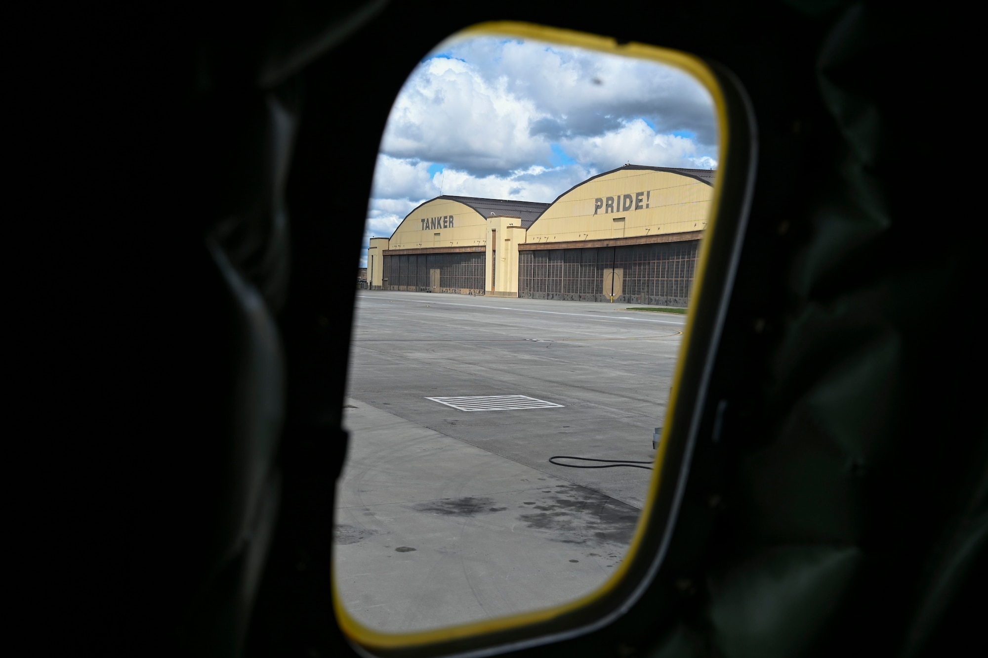 hangar is shown from the window of KC-135