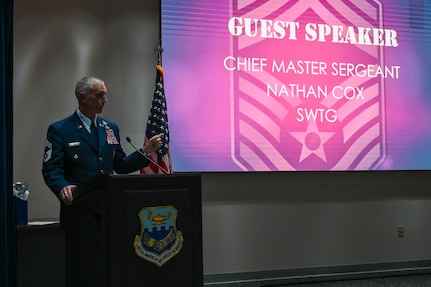 Chief Master Sgt. Nathan Cox, Special Warfare Training Group senior enlisted leader, speaks during an NCO Induction Ceremony at Joint Base San Antonio-Lackland, Texas on April 6, 2024.