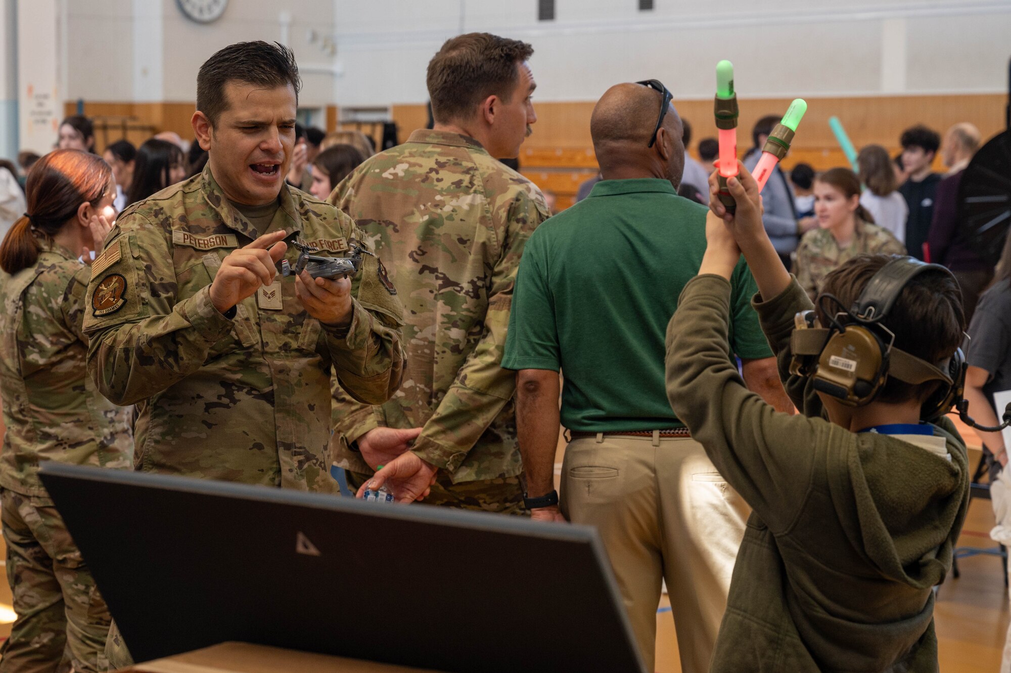Photo of DoDEA students participating in a career fair involving U.S. Air Force Airmen and community partners.
