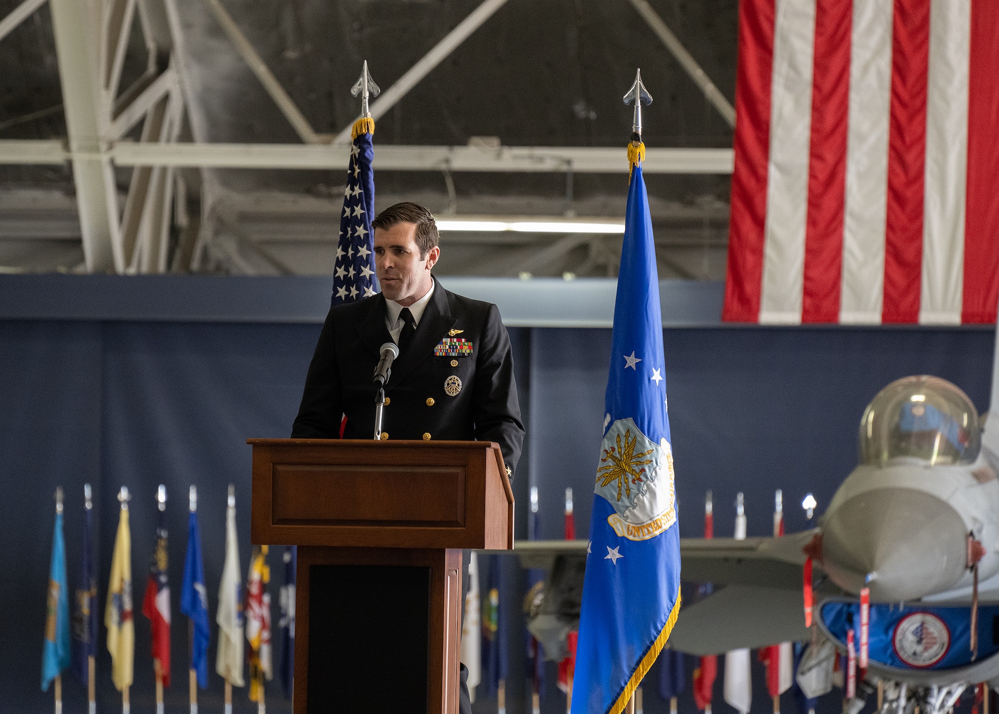 U.S. Navy Cmdr. Scott Angelo, Naval Air Facility Washington executive officer, gives his remarks at the Joint Base Andrews State of the Base Address, April 10, 2024.