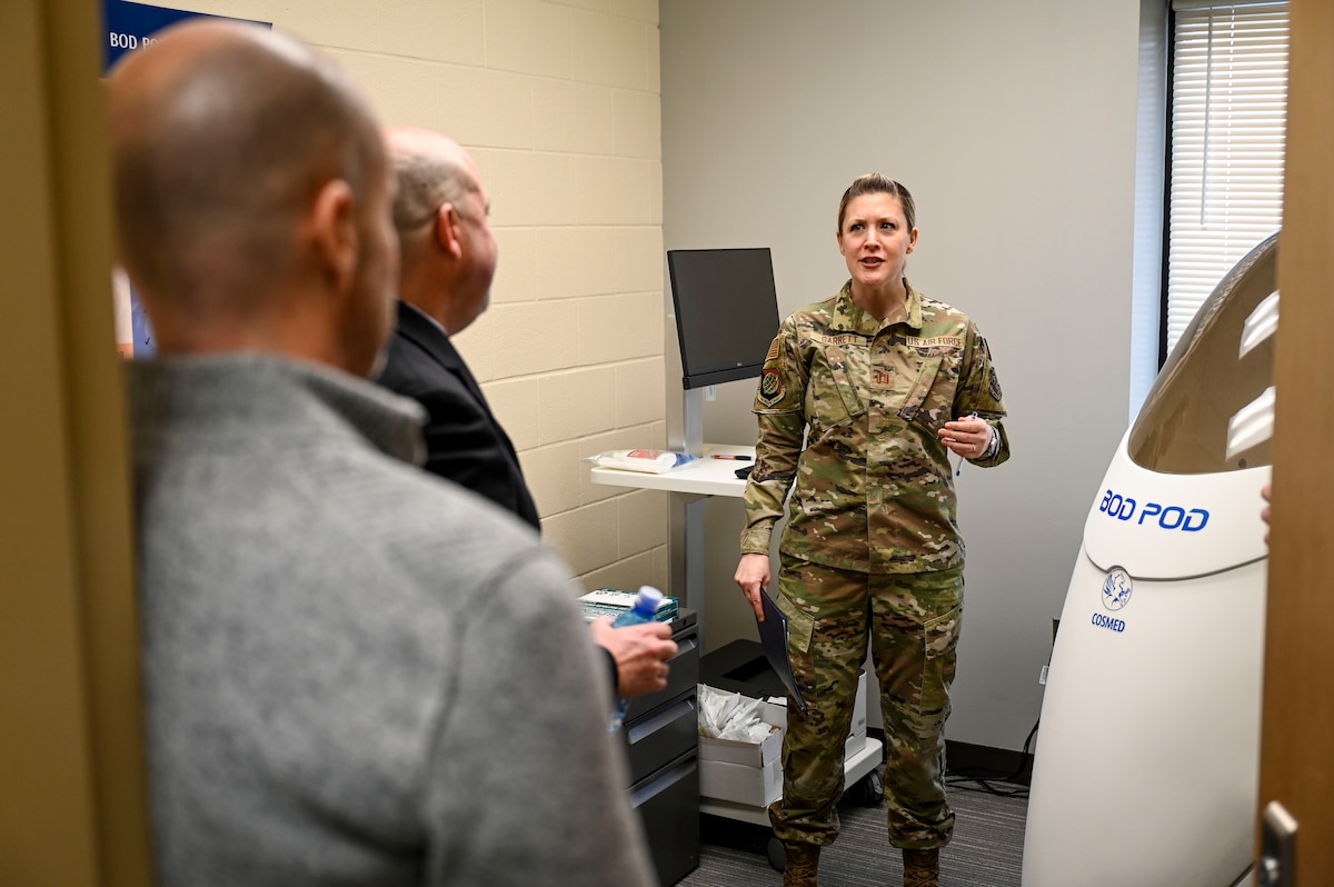 An Airman talks to DoD personnel