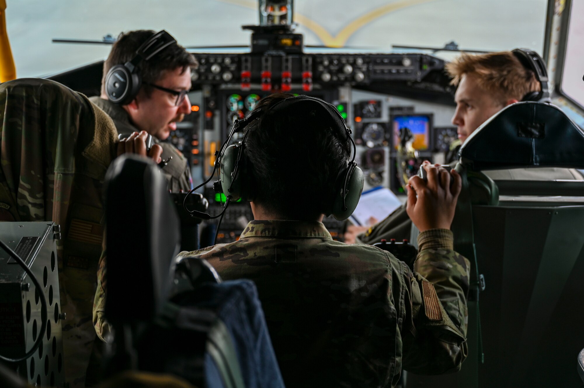 Airmen talk on aircraft