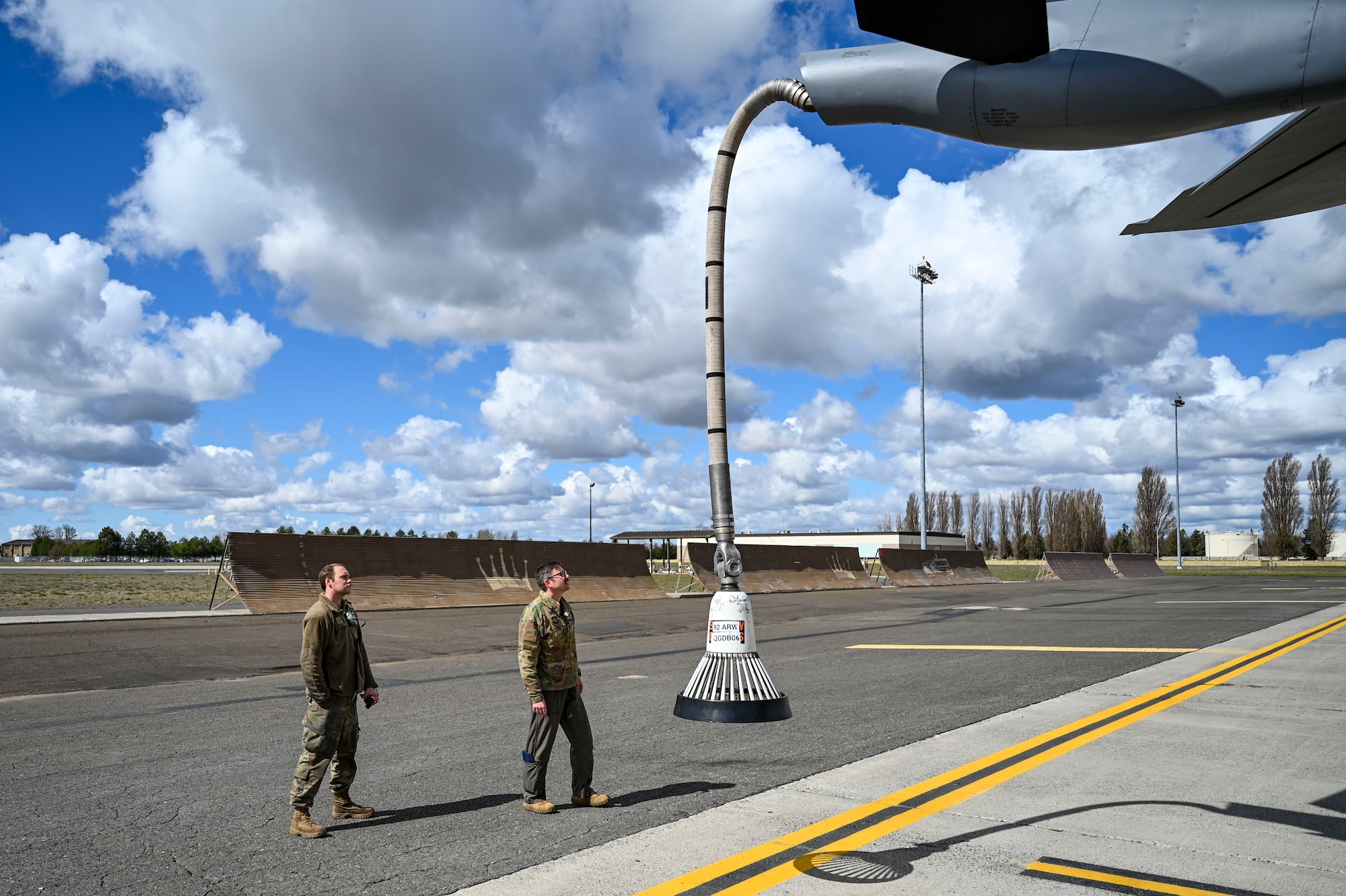 Airmen inspect aircraft