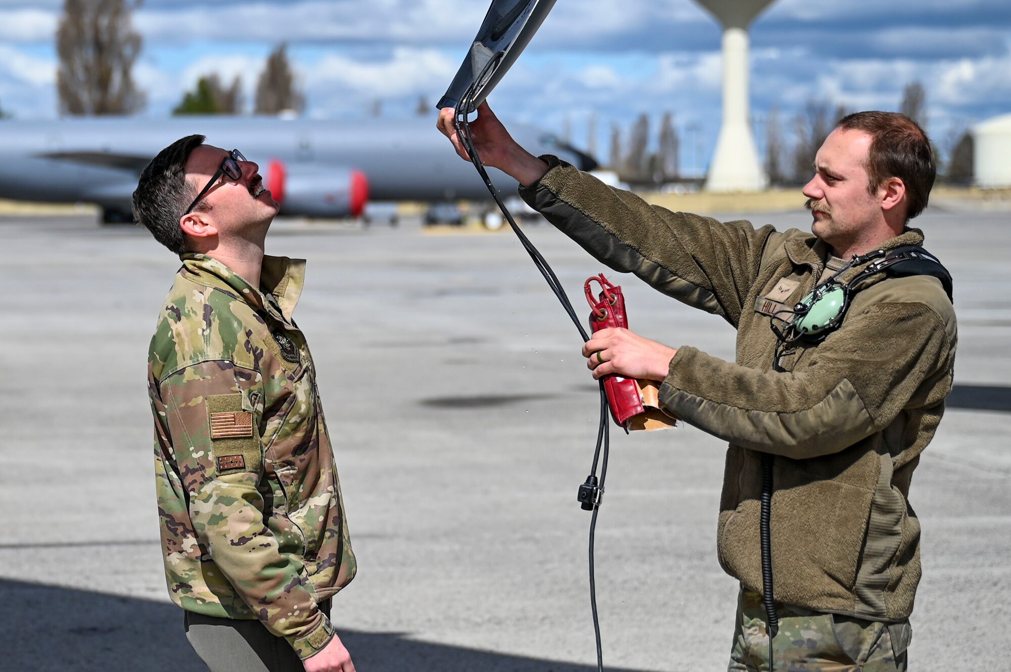 Airmen inspect aircraft