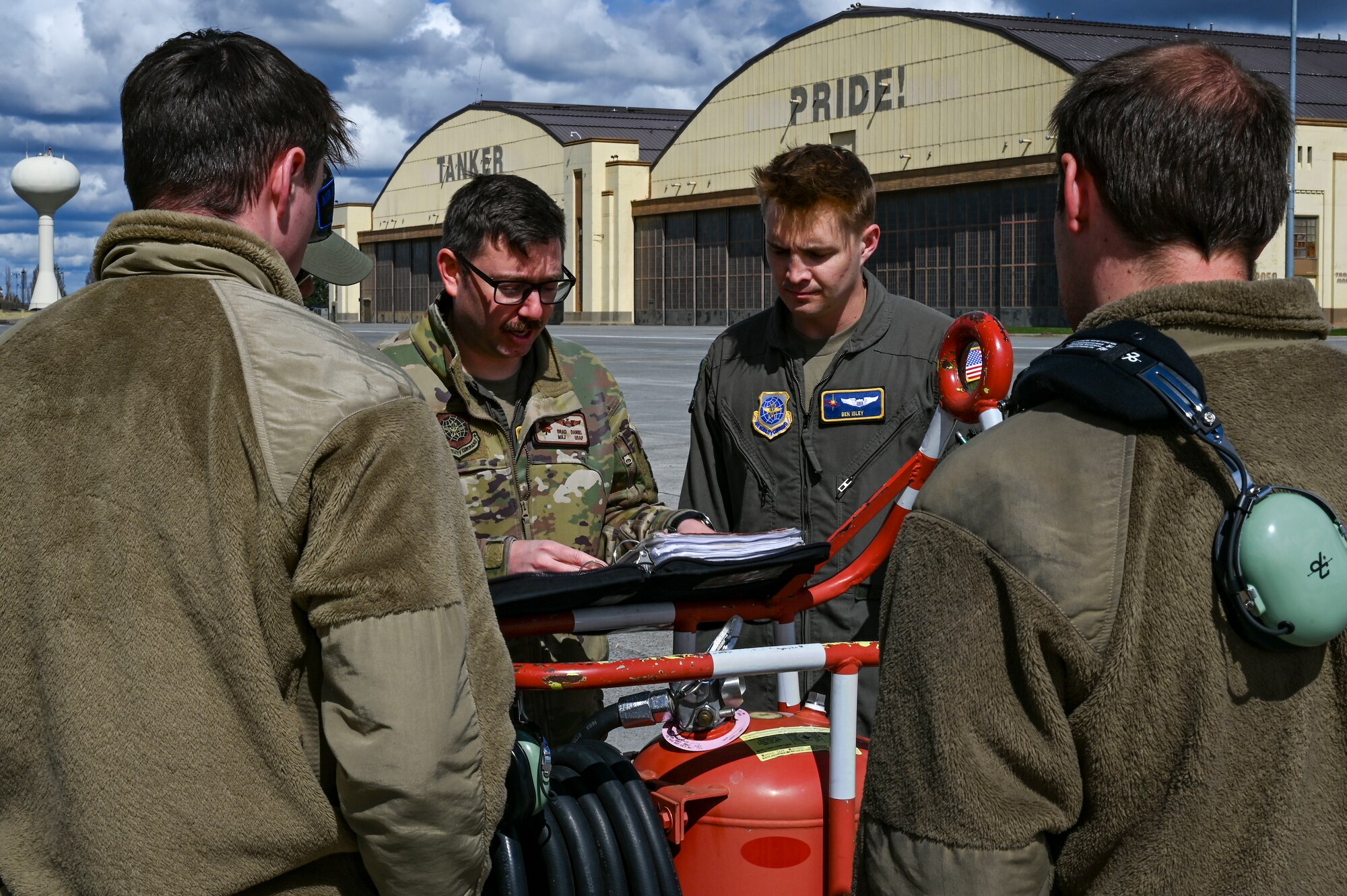 Airmen talk on flight line