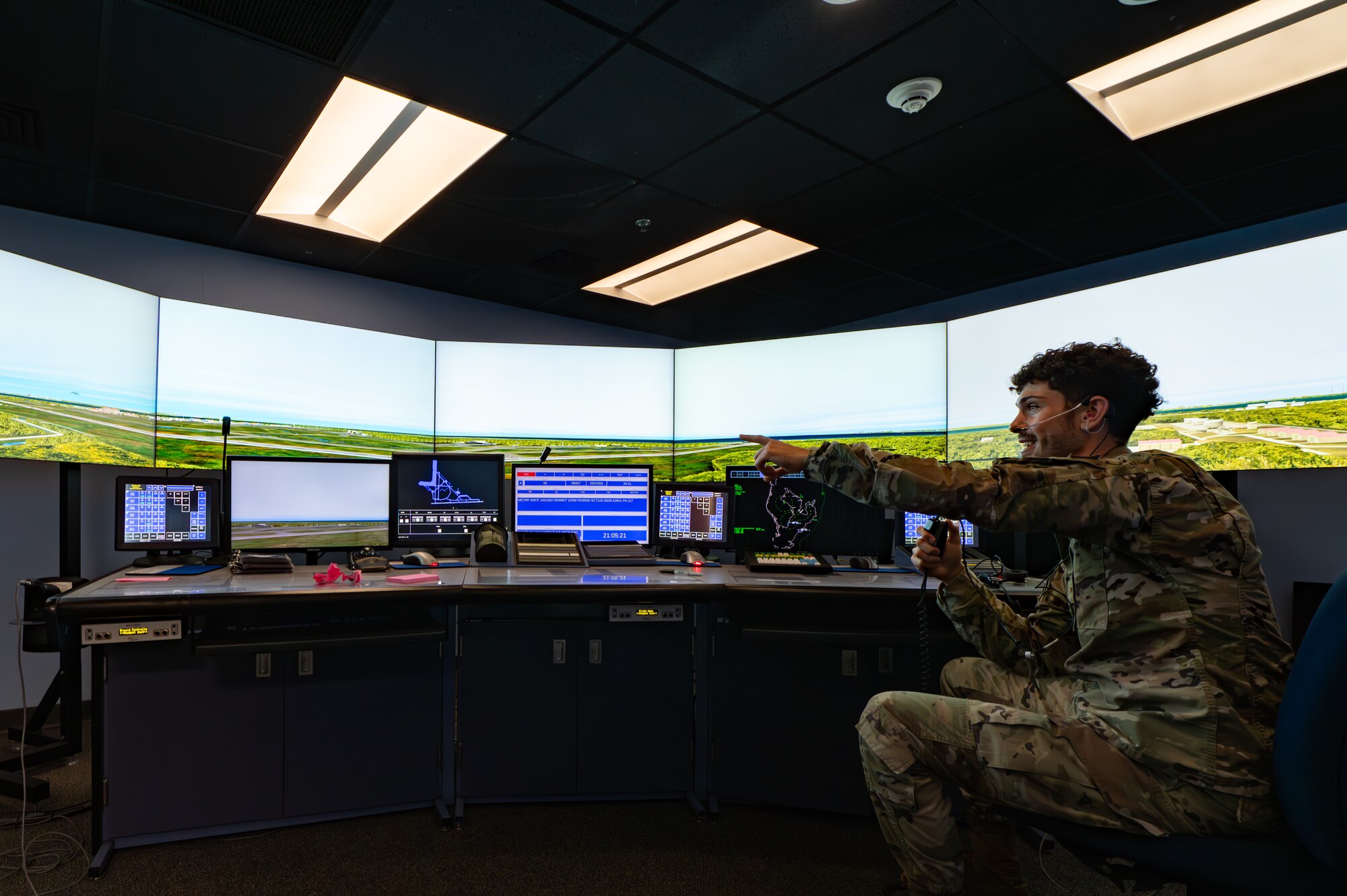 U.S. Air Force Senior Airman Jantzen Scott, 6th OSS air traffic control trainer, points at a screen during an ATC simulation at MacDill Air Force Base, Florida, April. 8, 2024.