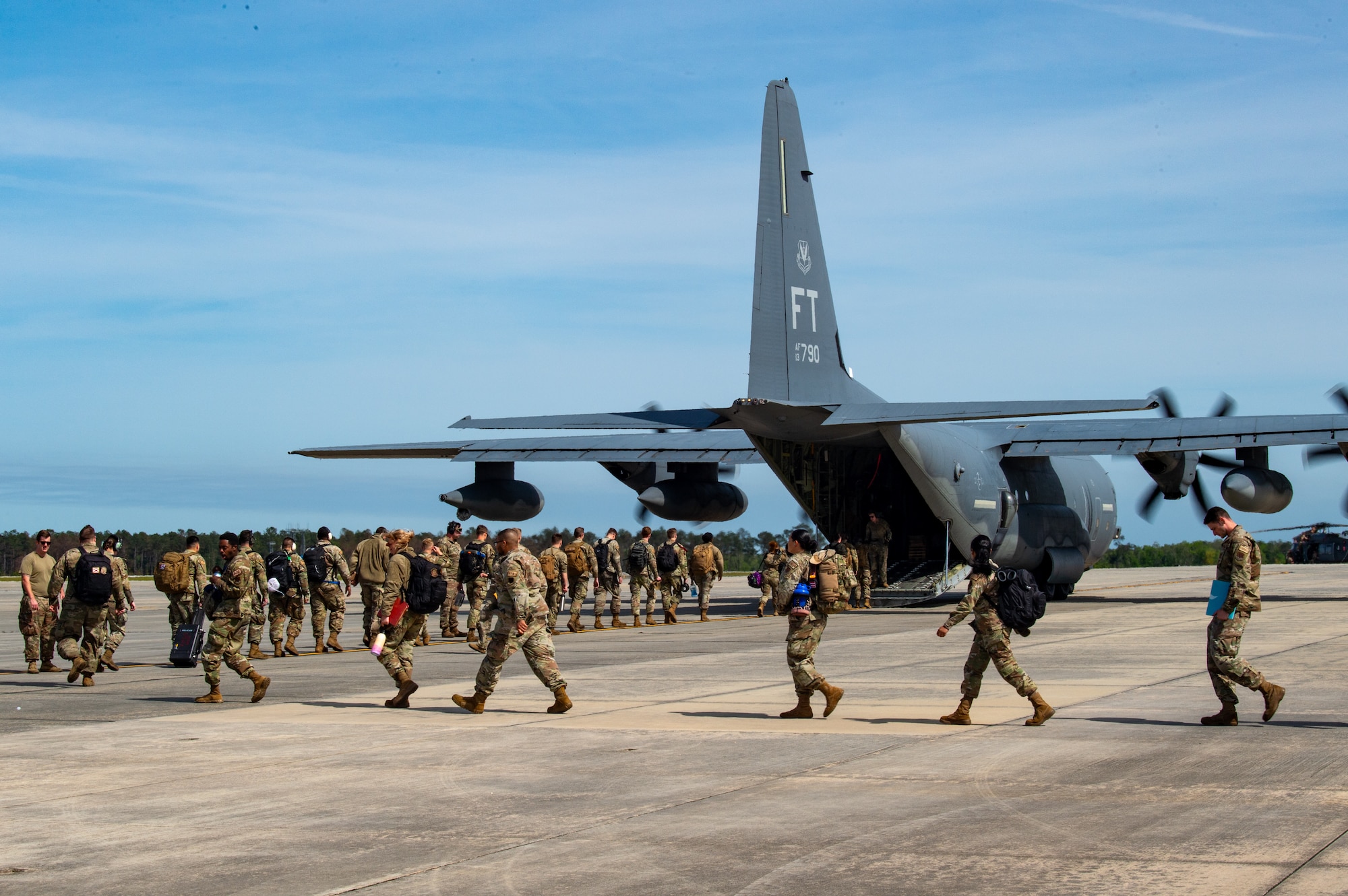 U.S. Air Force Airmen load an HC-130J Combat King II assigned to the 71st Rescue Squadron in support of Exercise Ready Tiger 24-1 at Moody Air Force Base, Georgia, April 8, 2024.  The 71st Rescue Squadron played a vital role in the exercise as they transported personnel and equipment to the various exercise locations.  During Ready Tiger 24-1, exercise inspectors will assess the 23rd Wing's proficiency in employing decentralized command and control to fulfill air tasking orders across geographically dispersed areas amid communication challenges, integrating Agile Combat Employment principles such as integrated combat turns, forward aerial refueling points, multi-capable Airmen, and combat search and rescue capabilities. (U.S. Air Force photo by Airman 1st Class Iain Stanley)