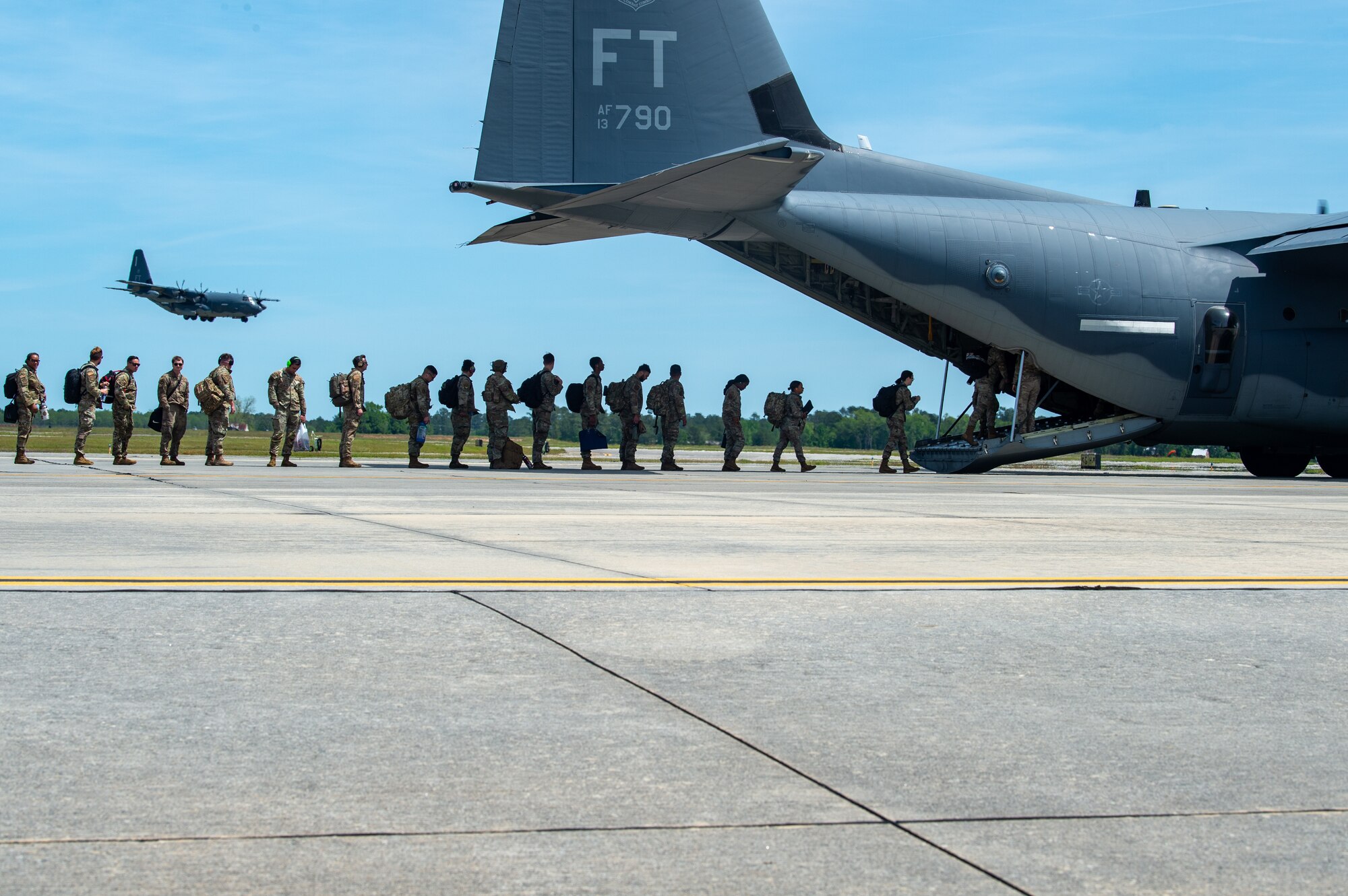 U.S. Air Force Airmen load an HC-130J Combat King II assigned to the 71st Rescue Squadron in support of Exercise Ready Tiger 24-1 at Moody Air Force Base, Georgia, April 8, 2024.  The 71st Rescue Squadron played a vital role in the exercise as they transported personnel and equipment to the various exercise locations.  During Ready Tiger 24-1, the 23rd Wing will be evaluated on the integration of Air Force Force Generation principles such as Agile Combat Employment, integrated combat turns, forward aerial refueling points, multi-capable Airmen, and combat search and rescue capabilities. (U.S. Air Force photo by Airman 1st Class Iain Stanley)