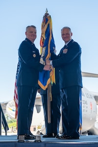 Col. Stephen Lanier (right) is presented the 315th Airlift Wing guidon by Maj. Gen. D. Scott Durham, Fourth Air Force commander, during an assumption of command ceremony April 14, 2024, at Joint Base Charleston, S.C. Lanier previously served as commander of the 916th Air Refueling Wing, Seymour Johnson Air Force Base, North Carolina. (U.S. Air Force photo by Tech. Sgt. Della Creech)