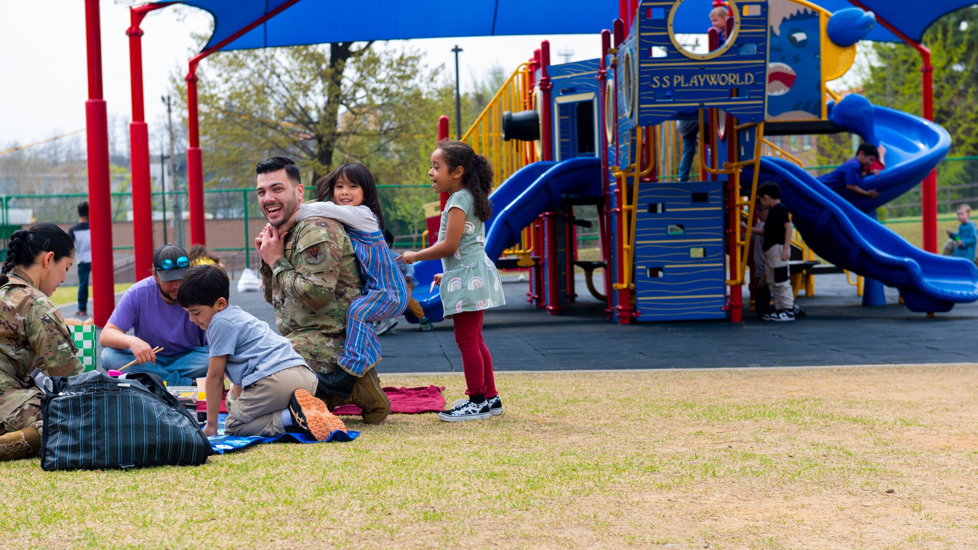 U.S military members assigned to Osan Air Base and their families gather during a Month of the Military Child picnic at Osan AB, Republic of Korea, April 10, 2024. MotMC recognizes the distinct experiences and sacrifices of children within military families. (U.S. Air Force photo by Senior Airman Kaitlin Frazier)