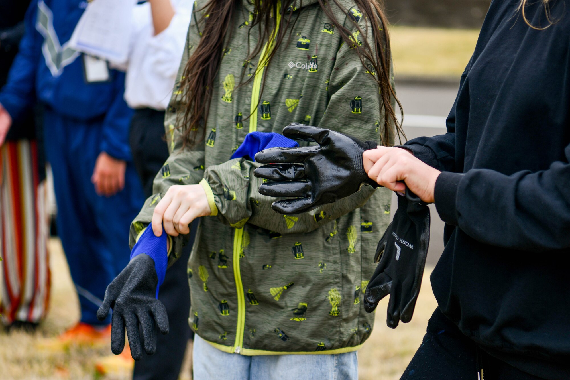 Students prepare to plant flowers.