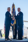 Col. Stephen Lanier (right) is presented the 315th Airlift Wing guidon by Maj. Gen. D. Scott Durham, Fourth Air Force commander, during an assumption of command ceremony April 14, 2024, at Joint Base Charleston, S.C. Lanier previously served as commander of the 916th Air Refueling Wing, Seymour Johnson Air Force Base, North Carolina. (U.S. Air Force photo by Tech. Sgt. Della Creech)