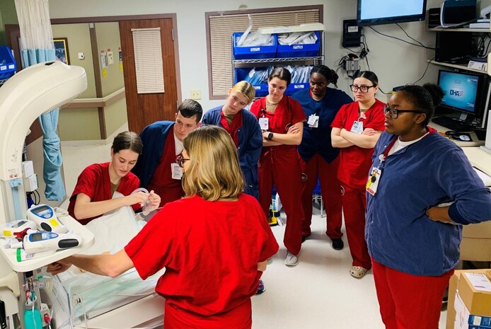 240301-N-JO616-2875 ROTA, Spain (Mar 1, 2024) Lieutenant Christina Acosta, a Labor and Delivery nurse on the Naval Hospital Rota Multiservice Ward, provides a clinical inservice to Medical-Surgical and Labor and Delivery nurses and corpsmen on newborn resuscitation procedures. As part of the units merger, a robust cross-training initiative was implemented to ensure staff were prepared with the skills needed to care for patients across the lifespan. (Released: CDR Jenny Paul)