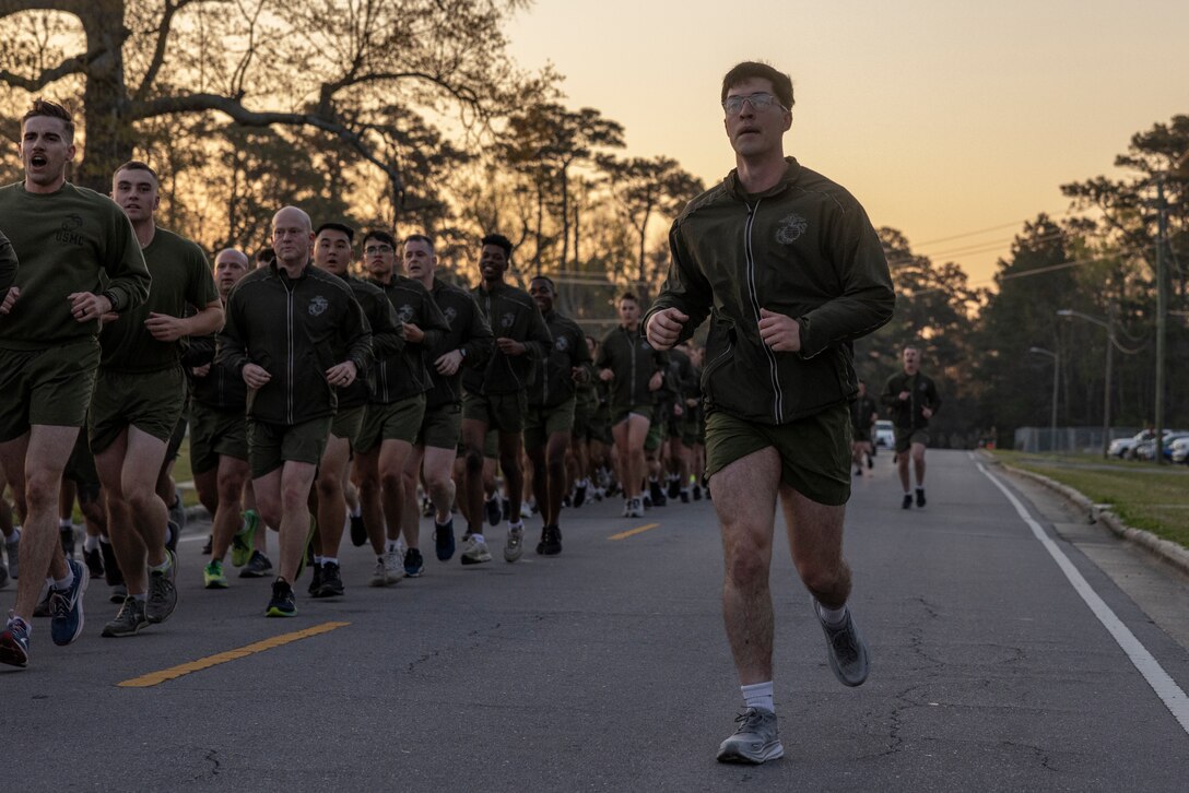 U.S. Marine Corps Sgt. Timothy Fowler, a Boardman, Ohio native and graphics chief with Headquarters Battalion, 2d Marine Division, calls cadence during a motivation run on Camp Lejeune, North Carolina, March 21, 2024. The motivational run was three miles and used to build cohesion and promote fitness. (U.S. Marine Corps photo by Lance Cpl. Oliver Nisbet)