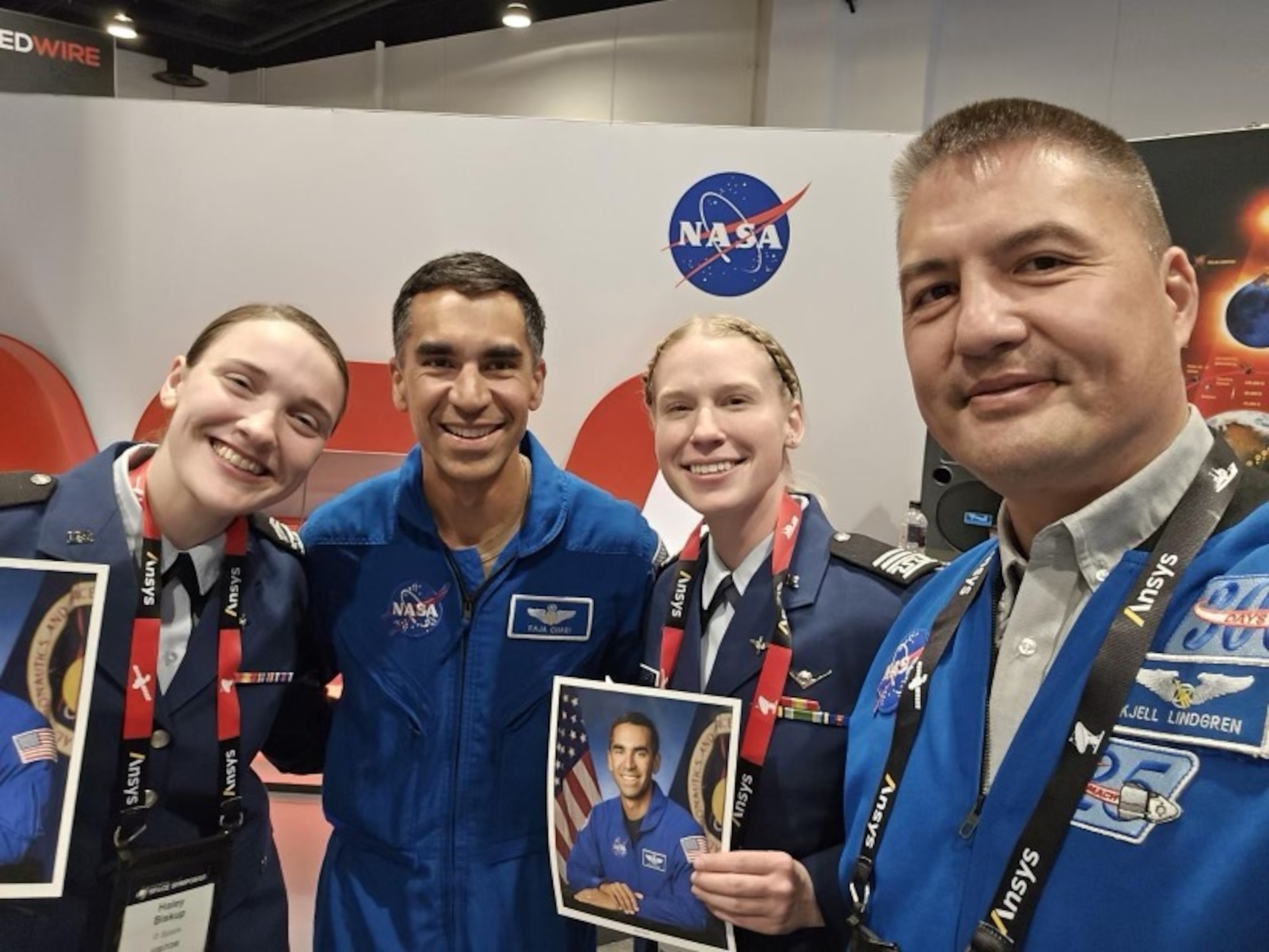 National i5 Space Student Leaders pose for a photo with NASA astronauts, Raja Chari, left, and Kjell Lindgren, right, during the 39th Space Symposium in Colorado Springs, Colo., April 9, 2024. i5 Space is an undergraduate space-focused national student organization, created just a few years ago. As of today, i5 Space has roughly 1,100 students involved, 68 different ROTC units, and consisting of more than 100 universities. (Courtesy photo)