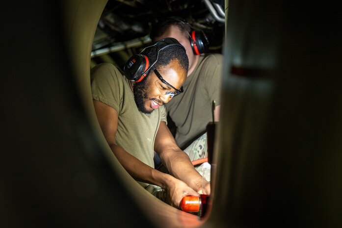 U.S. Air Force Airman 1st Class Trevor Robinson, 9th Maintenance Squadron aircraft structural maintenance apprentice, uses a rivet tool to repair the inside of a U-2 Dragon Lady on Beale Air Force Base, California, Dec. 19, 2023.