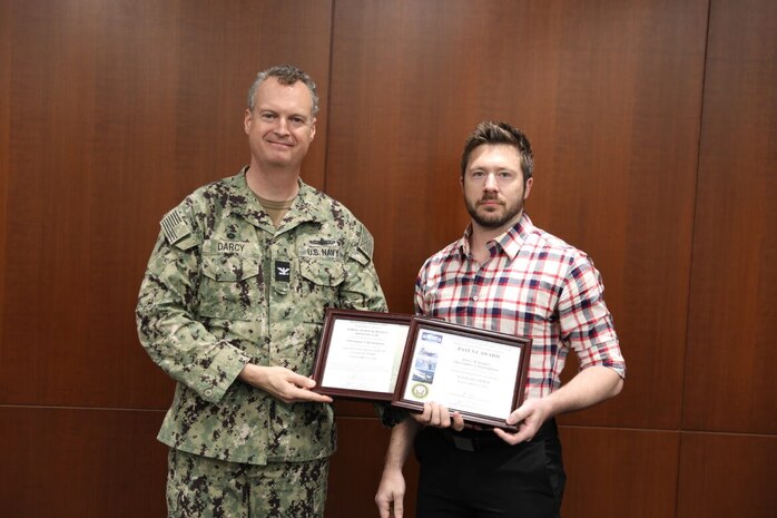 Christopher Buckingham, a mechanical engineer from Naval Surface Warfare Center, Philadelphia Division (NSWCPD), is recognized during NSWCPD’s 2023 2nd Quarter Awards Ceremony with the Philadelphia Division Inventor’s Club Award for the commercial licensing of the patent for the Acoustically Stiff Wall. (U.S. Navy Photo by Phil Scaringi/Released)