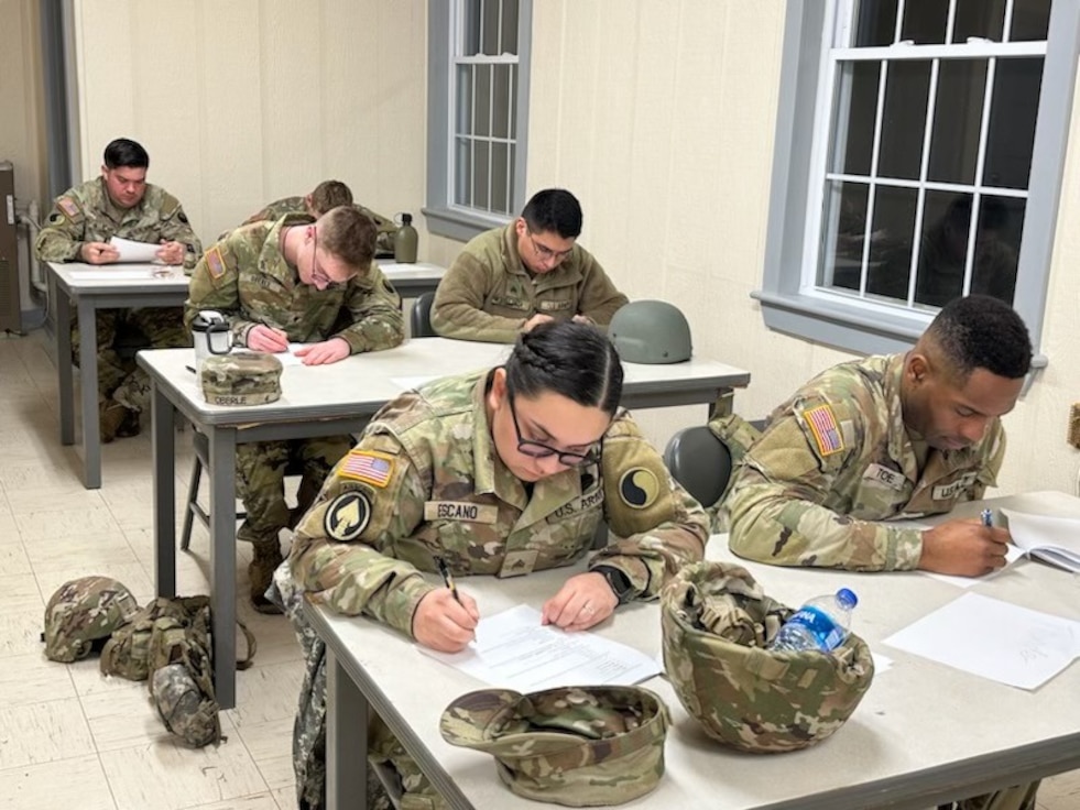 Sgt. Stella Escano takes a written exam alongside her fellow competitors at the 116th Infantry Brigade Combat Team’s Best Warrior Competition held Jan. 5-7, 2024, at Fort Barfoot, Virginia. (Courtesy photo)