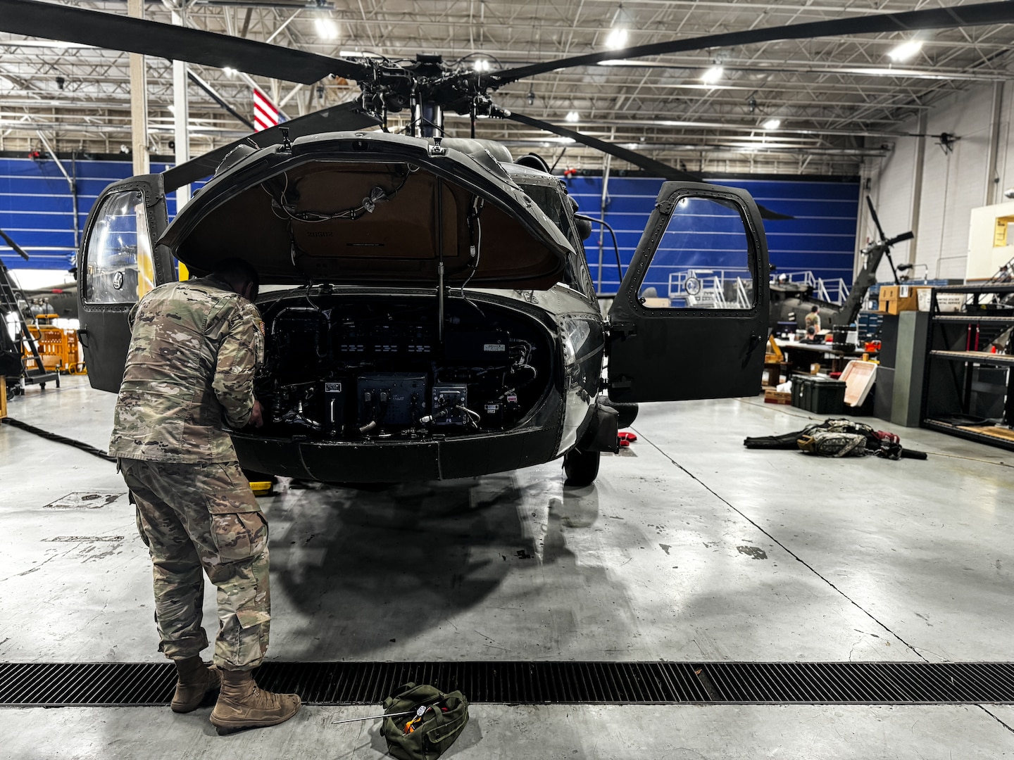 Virginia National Guard Soldiers conduct maintenance on a UH-60 Black Hawk helicopter April 2, 2024, at the Army Aviation Support Facility in Sandston, Virginia. The Soldiers are part of the AASF’s avionics shop, which troubleshoots, diagnoses and repairs avionic components and wiring on the VNG’s Black Hawk fleet. (U.S. Army National Guard photo by Sgt. 1st Class Terra C. Gatti)