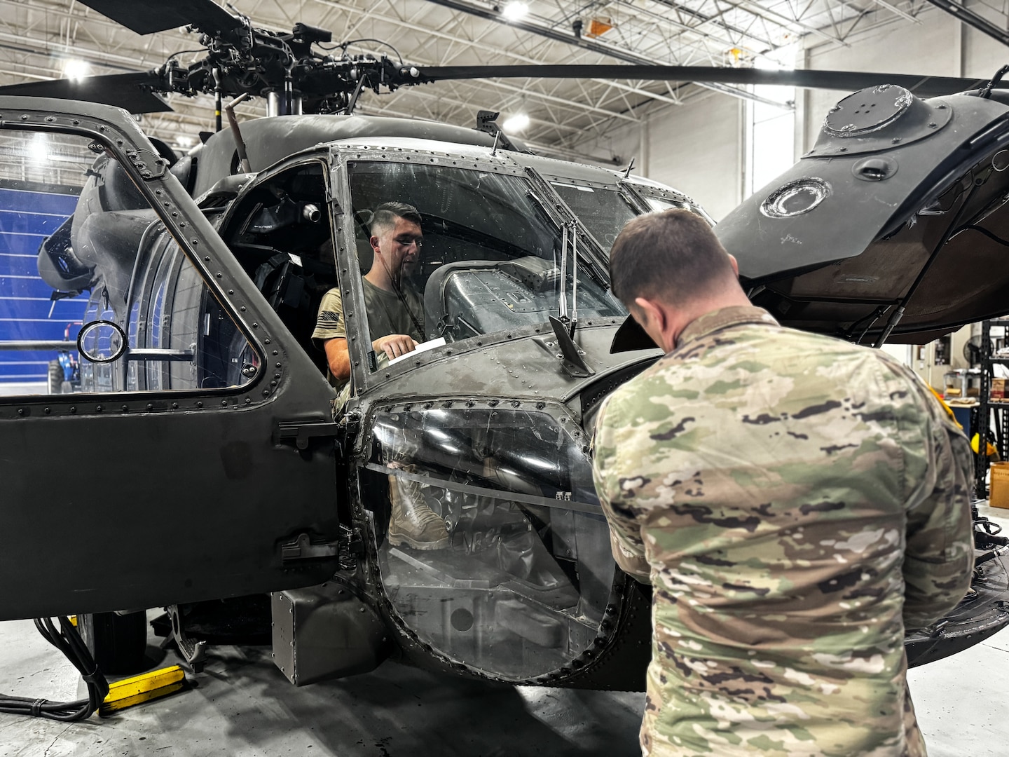 Virginia National Guard Soldiers conduct maintenance on a UH-60 Black Hawk helicopter April 2, 2024, at the Army Aviation Support Facility in Sandston, Virginia. The Soldiers are part of the AASF’s avionics shop, which troubleshoots, diagnoses and repairs avionic components and wiring on the VNG’s Black Hawk fleet. (U.S. Army National Guard photo by Sgt. 1st Class Terra C. Gatti)